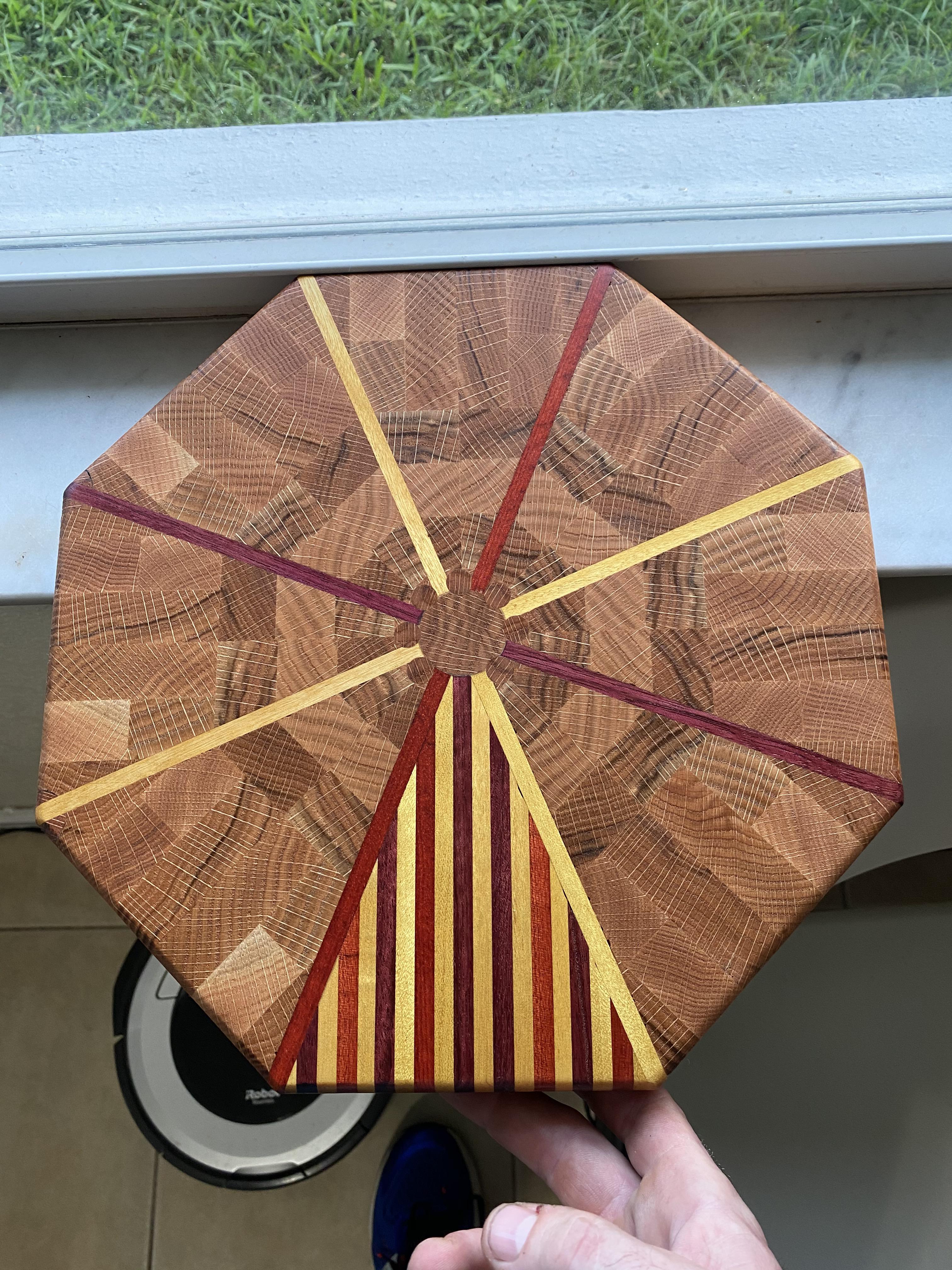 Oak, oak dowels, Purple Heart, yellow heart, and blood wood. Made to