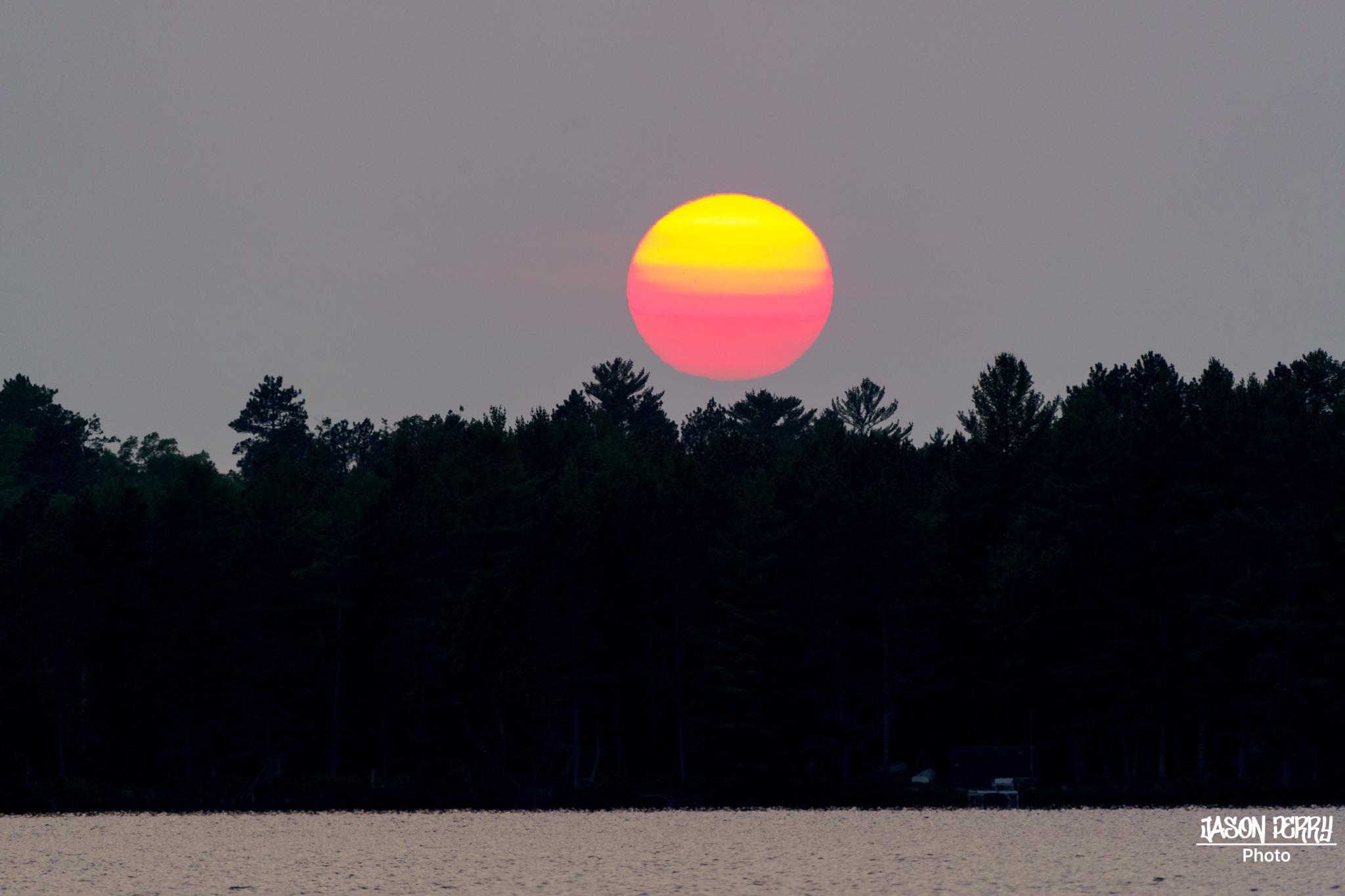 Hazy sunset in Conover, WI last night. r/wisconsin