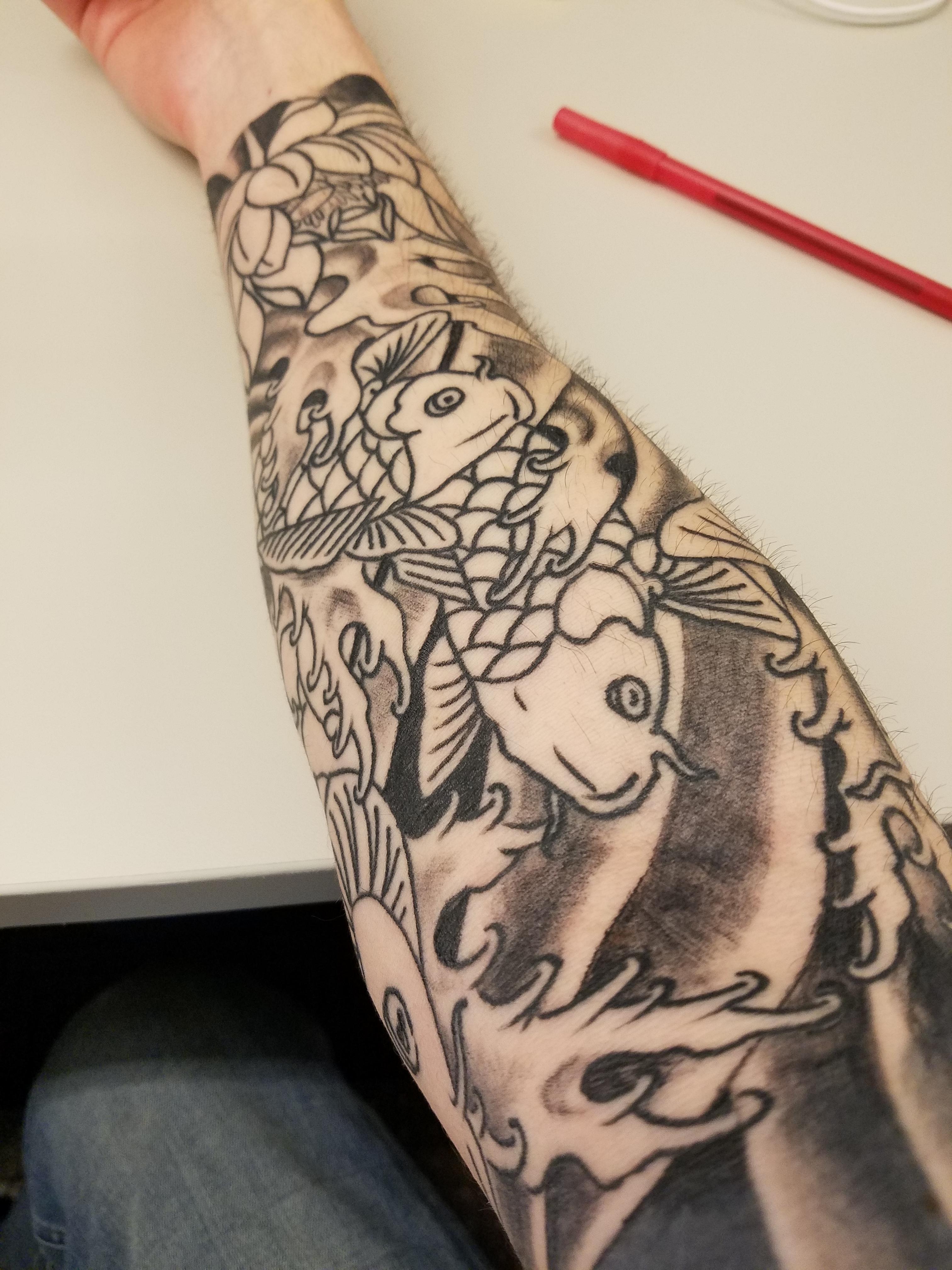 Finally getting my sleeve finished. Koi fish done by Greg