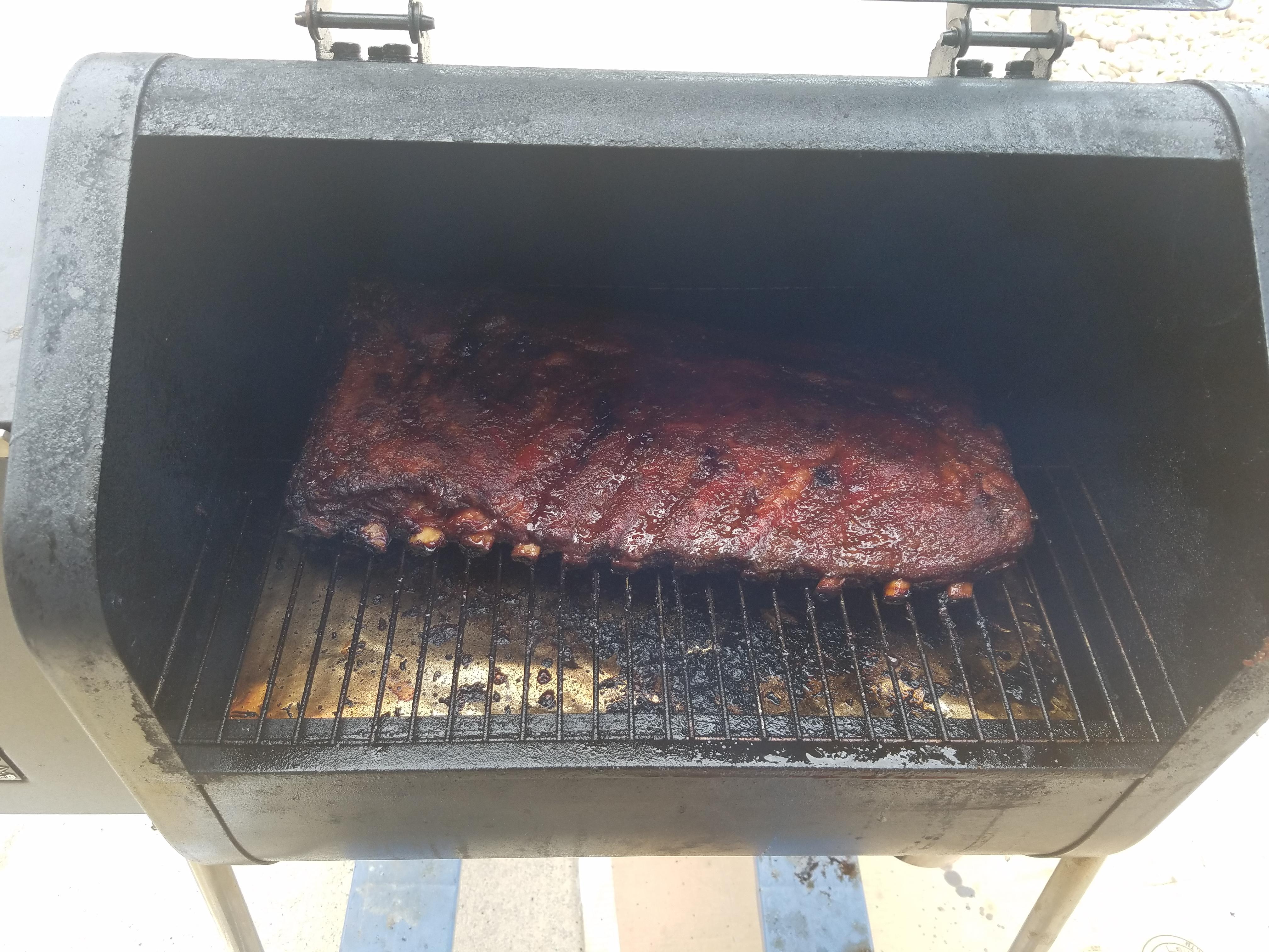 Spare ribs on my GMG Davy Crockett. Yum r/pelletgrills