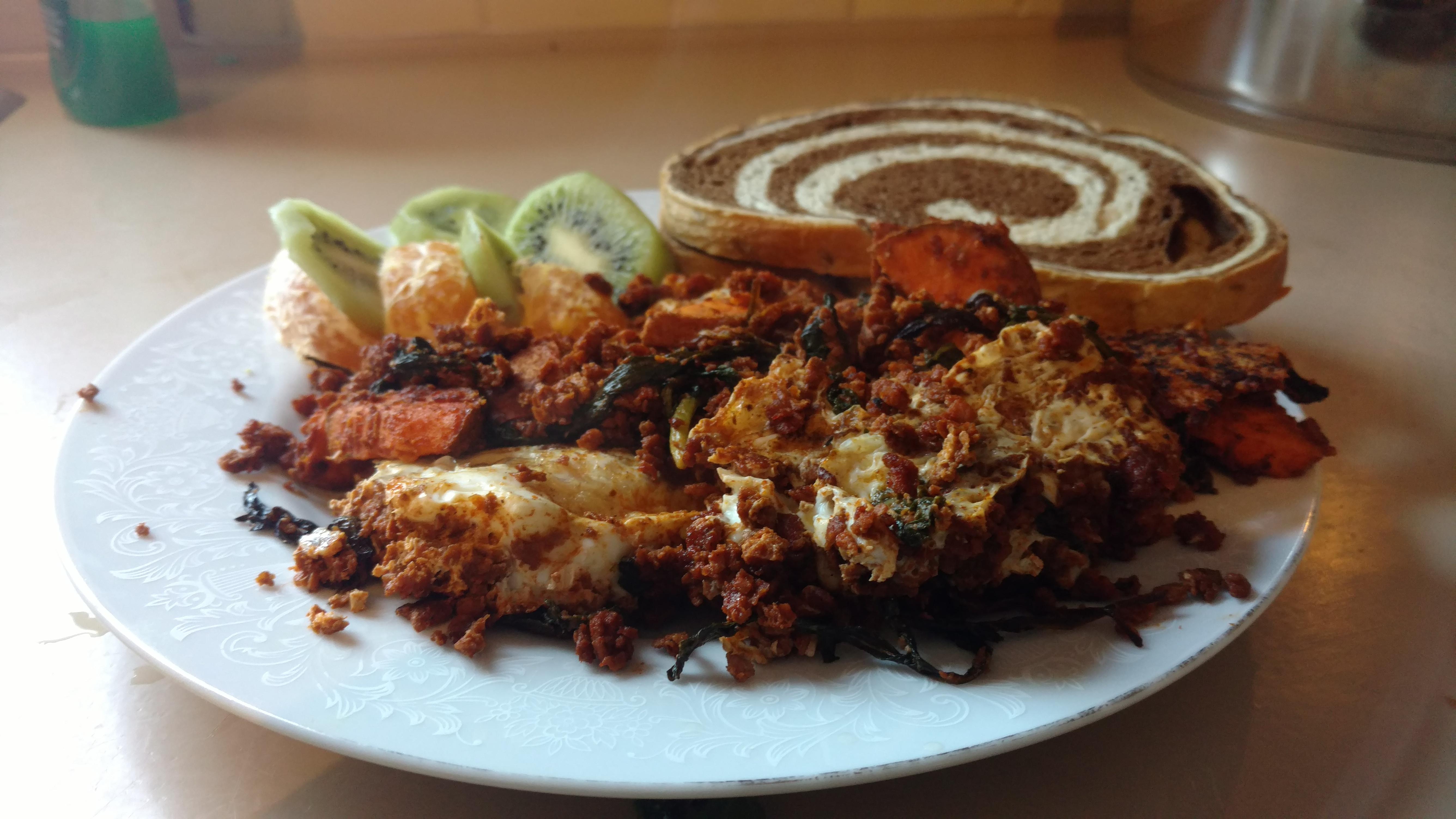 Soy chorizo and sweet potato hash with eggs and marble rye, side of