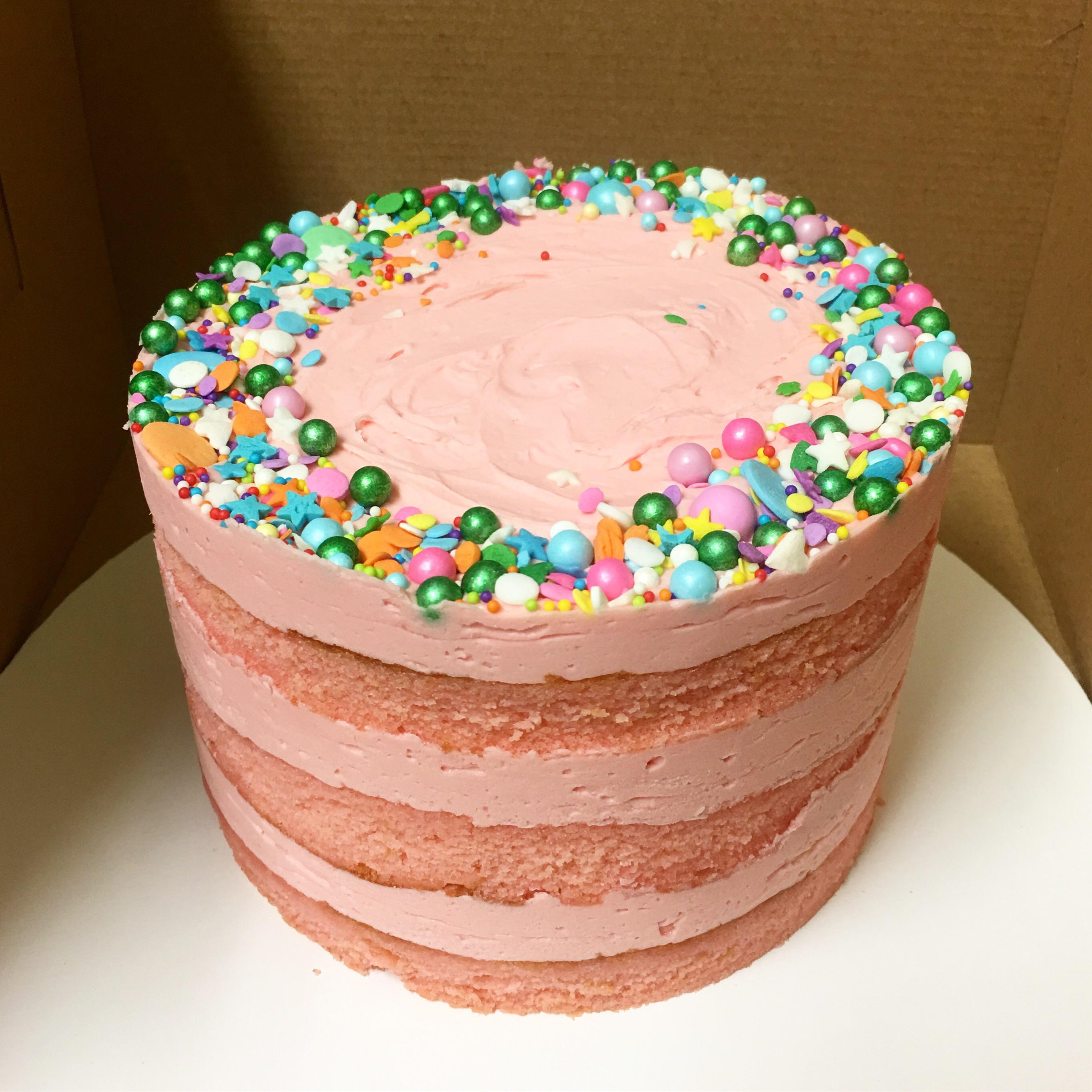 [Homemade] pink vanilla spongecake with vanilla frosting, strawberry