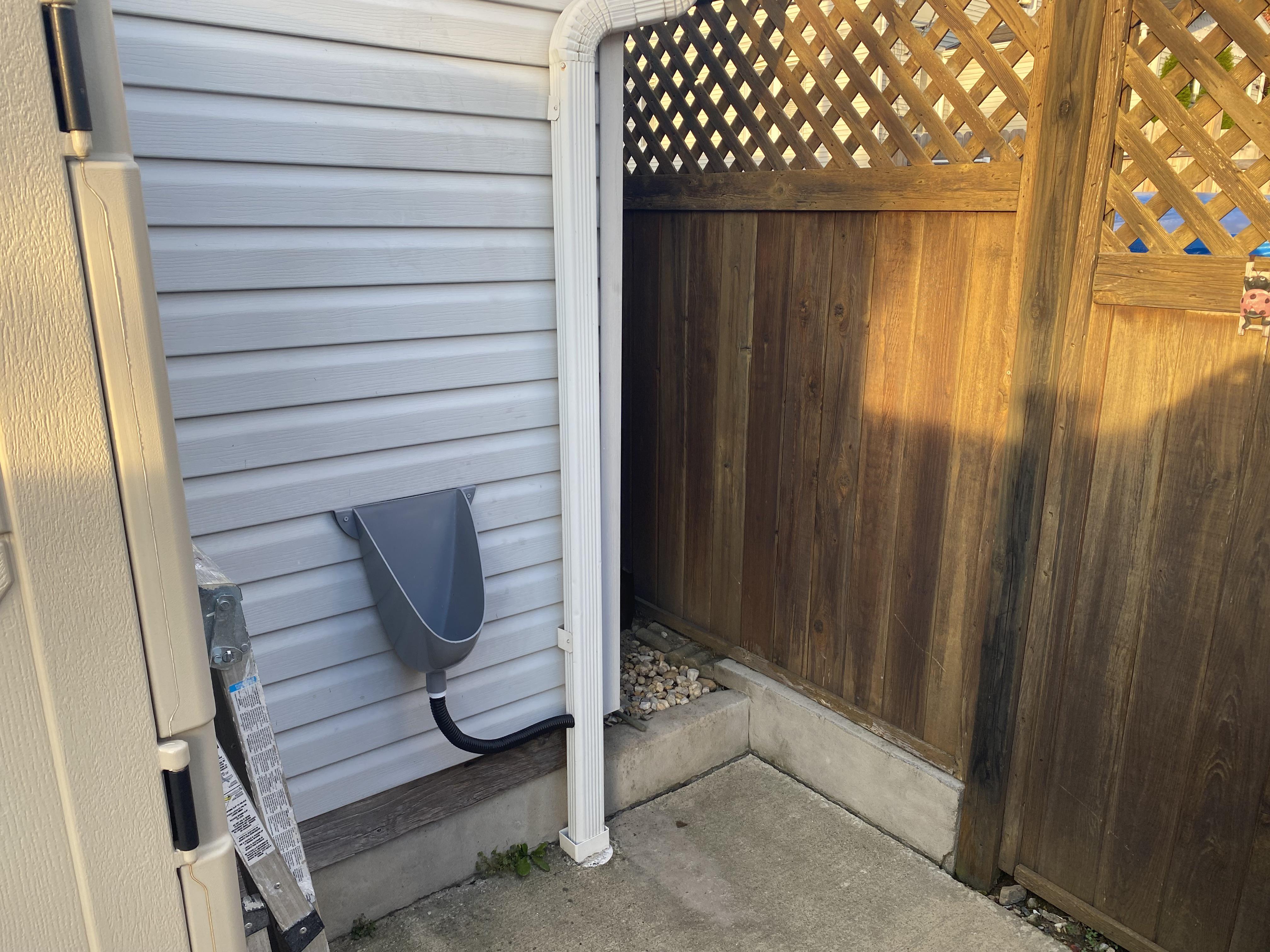 This outdoor urinal my moms boyfriend set up outside of his shed. r