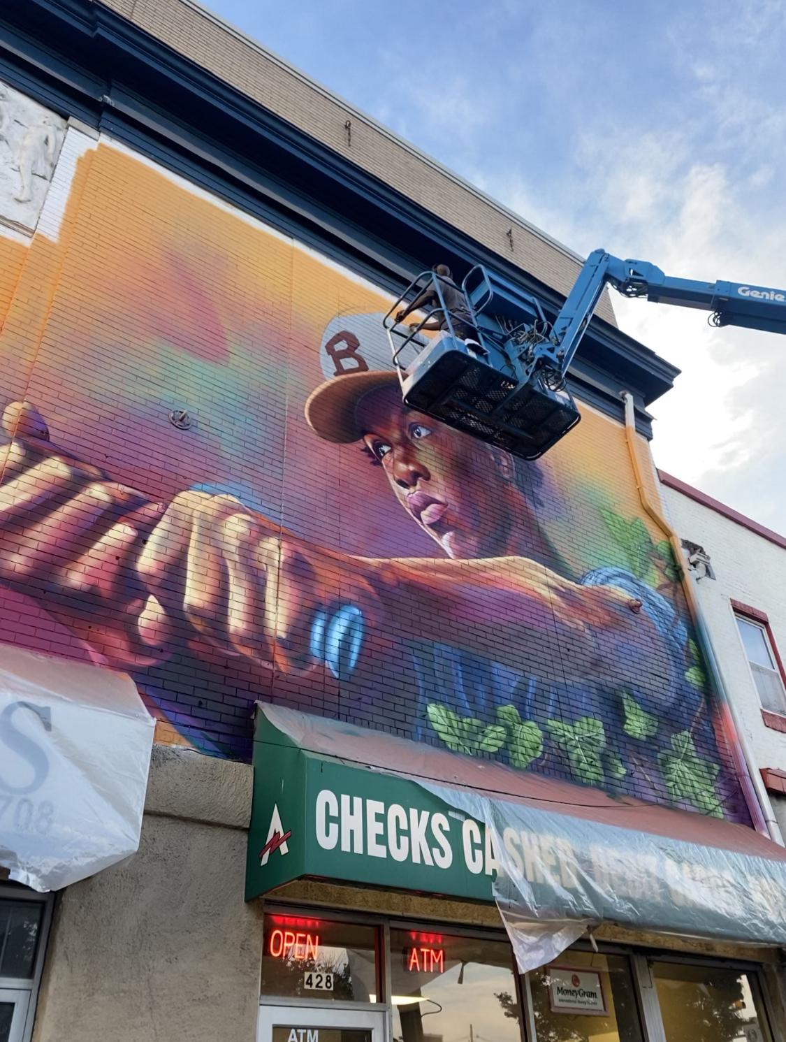 New Mural being painted in Waverly Main Street r/baltimore