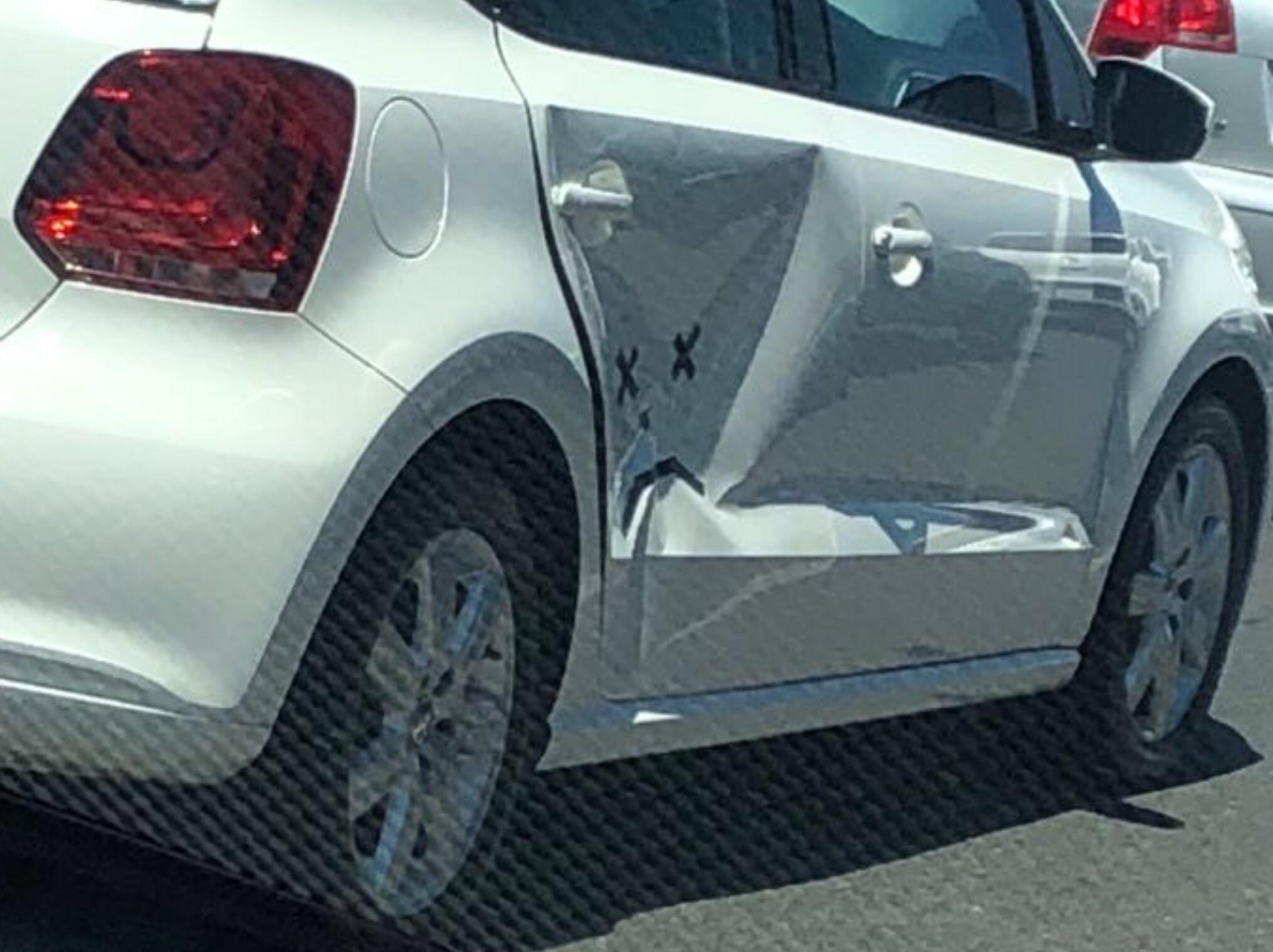 Saw this guy driving around with a nasty dent in his car. At least he