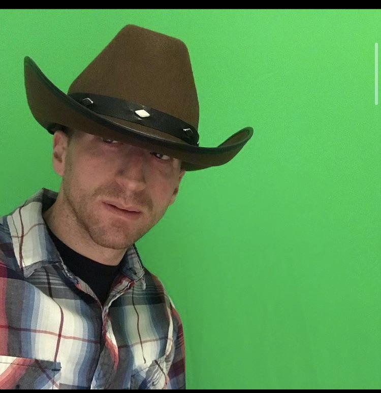 Wearing a cowboy hat backwards is almost too much, even for Mikey. r