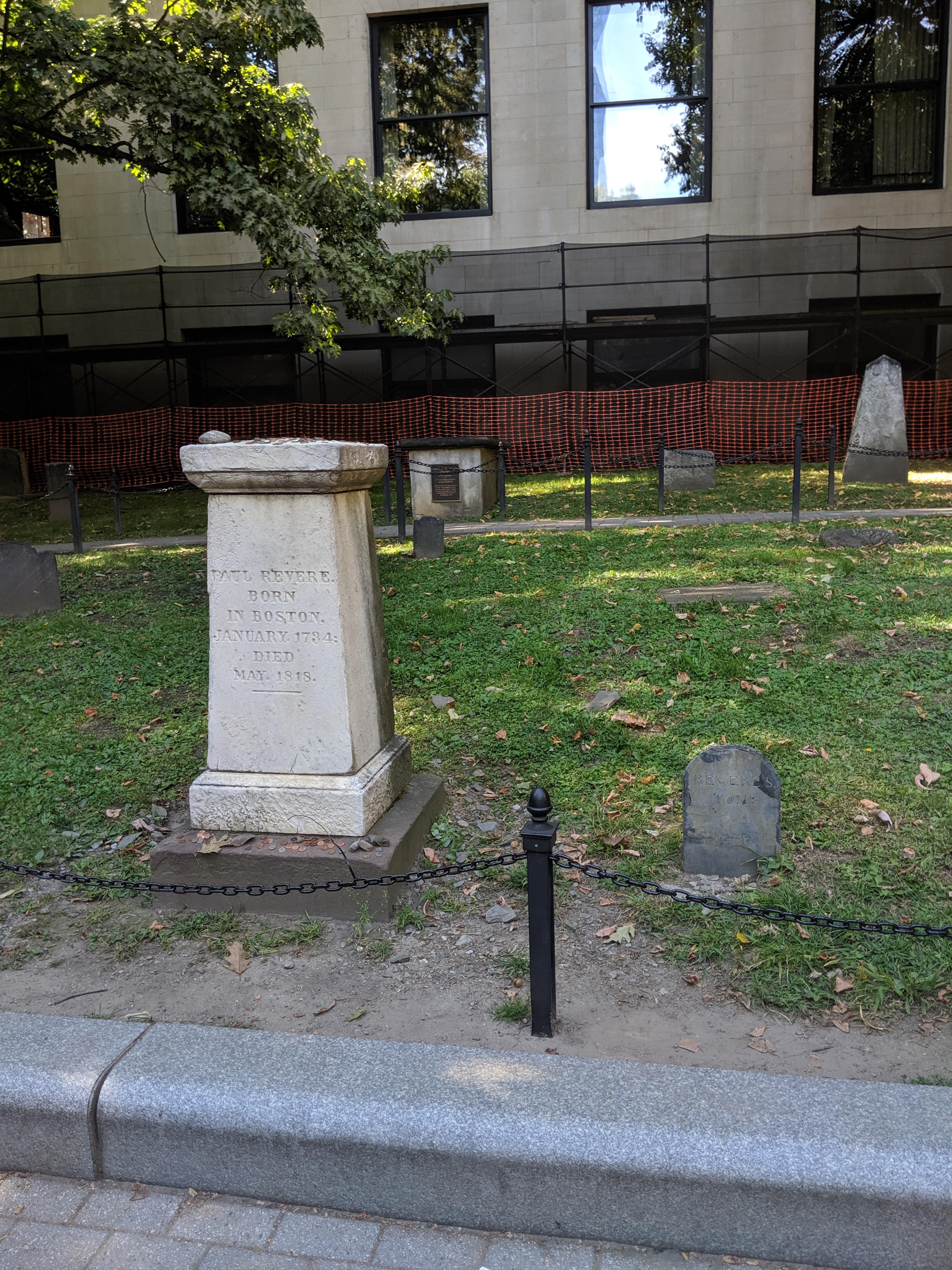 Paul Revere's original headstone (right) and the new headstone covered