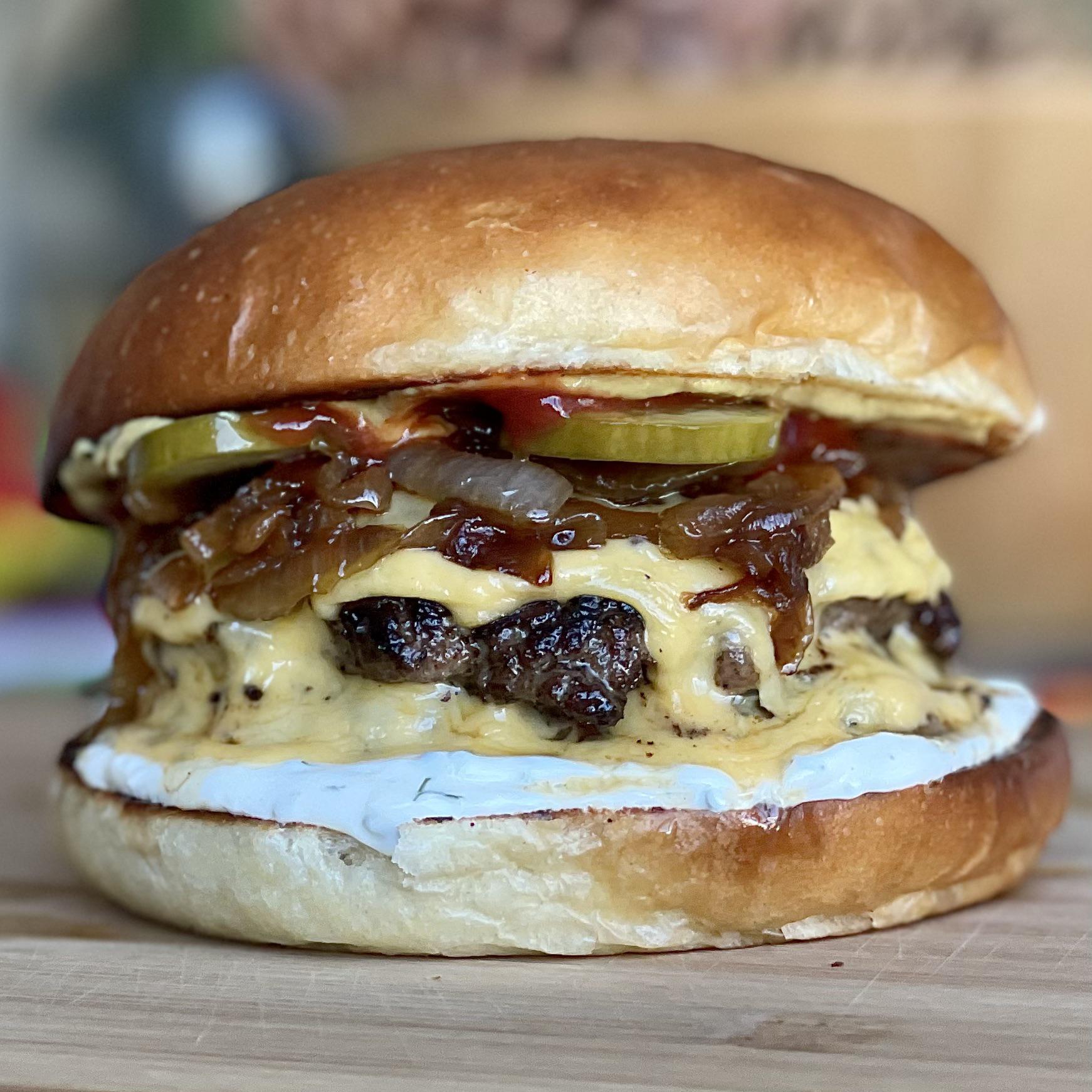 Double Cheeseburger on a homemade Brioche Bun with caramelized onions