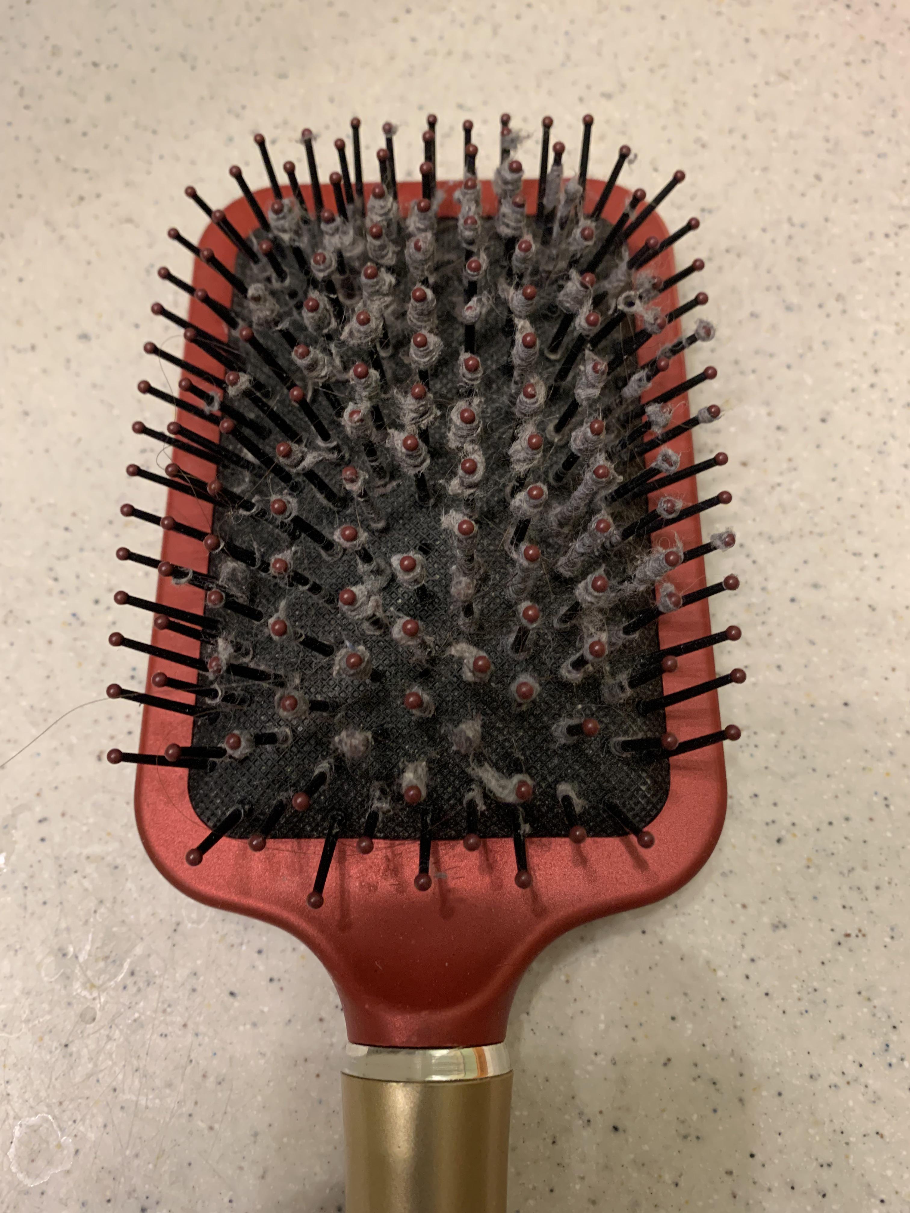 Does anyone know why my hairbrush does this? And how to clean it easier