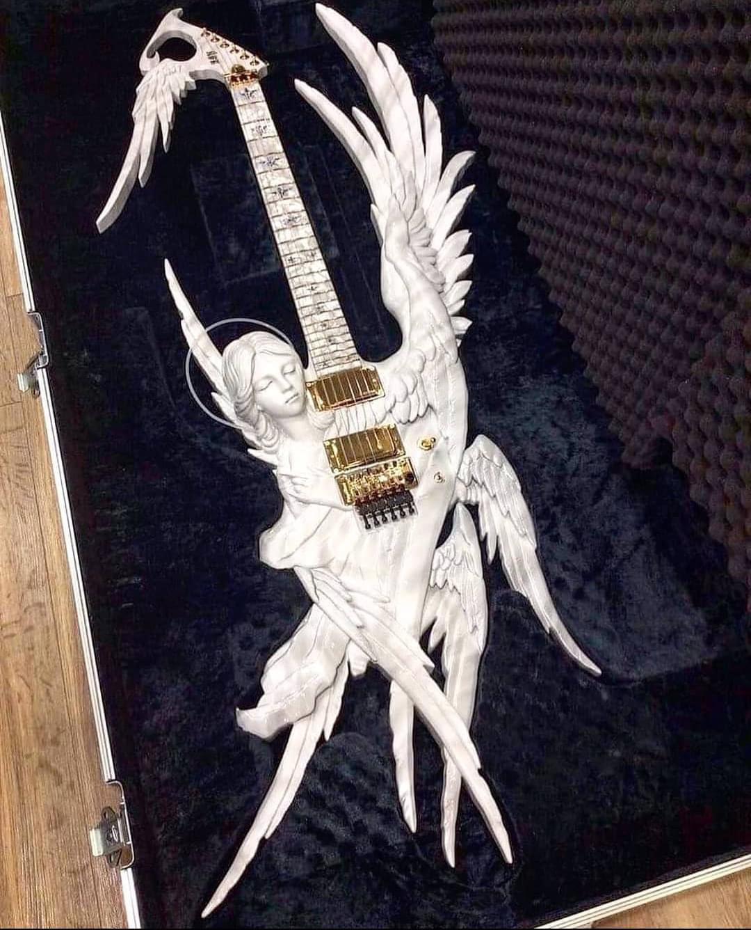 An angel of a guitar. I'm sure it isn't easy to play though. r/pics