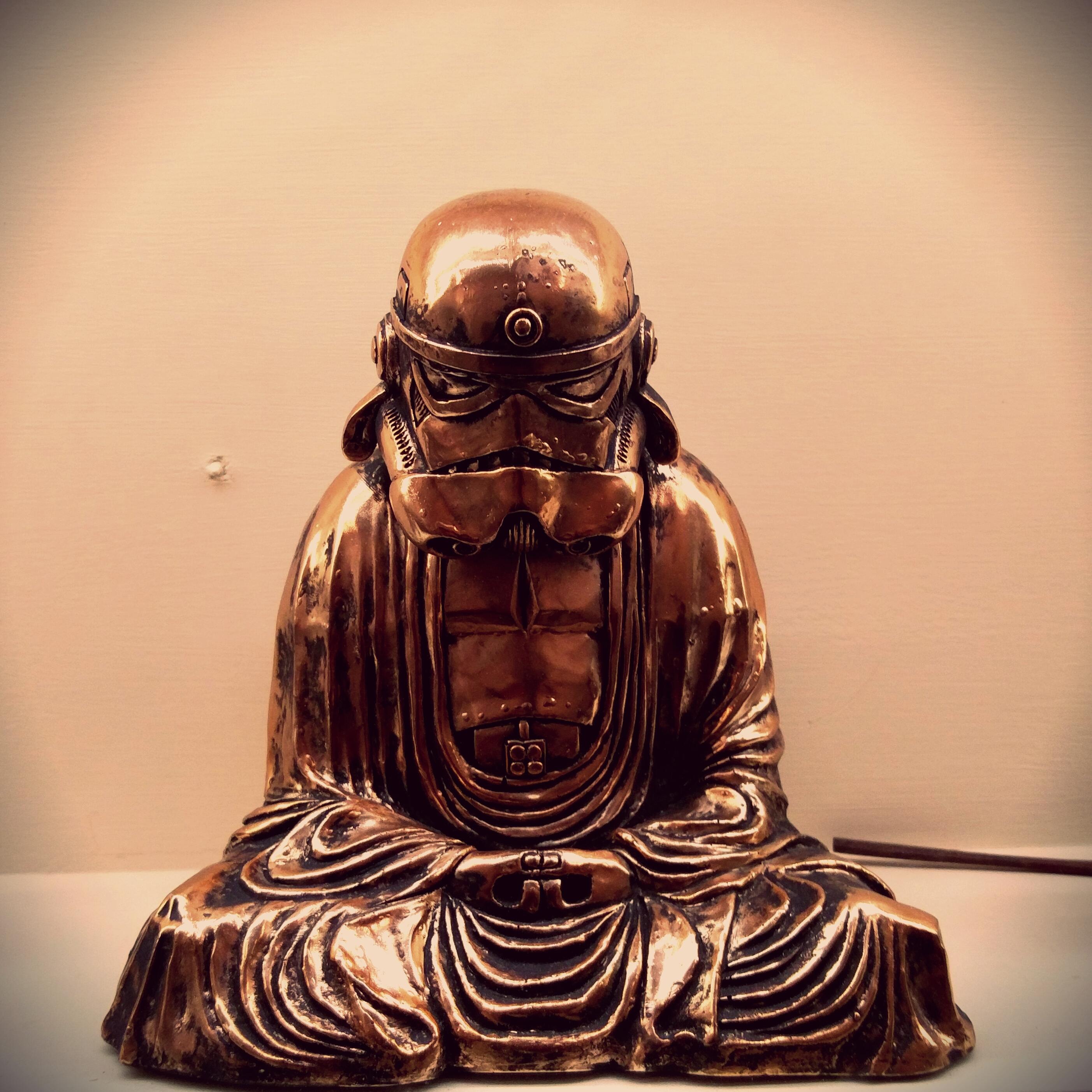 Stormtrooper head on Buddha statue at local Thai restaurant