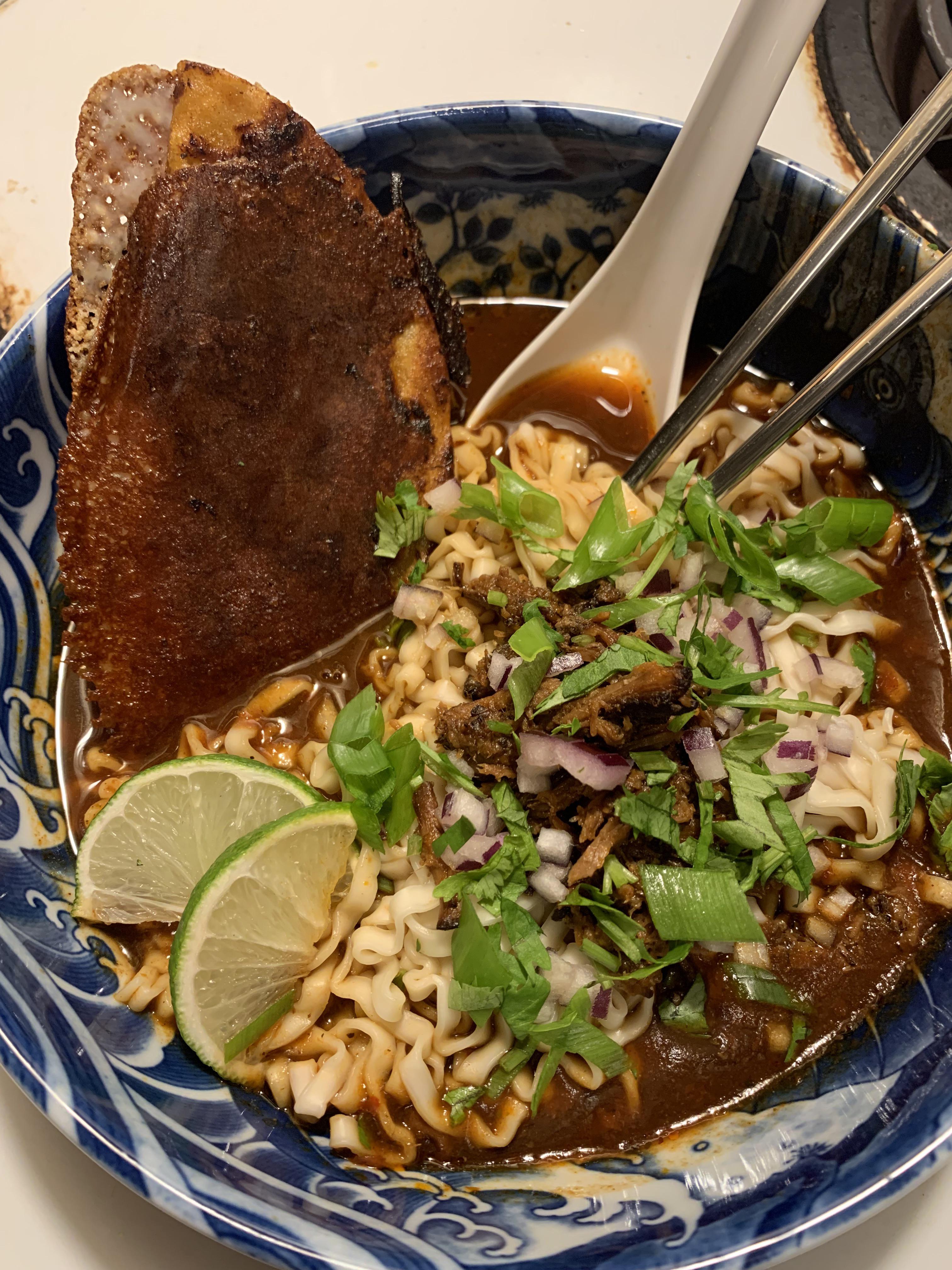 Birria ramen with a consommé broth and a fried cheese birria taco garnish 🌮 ramen