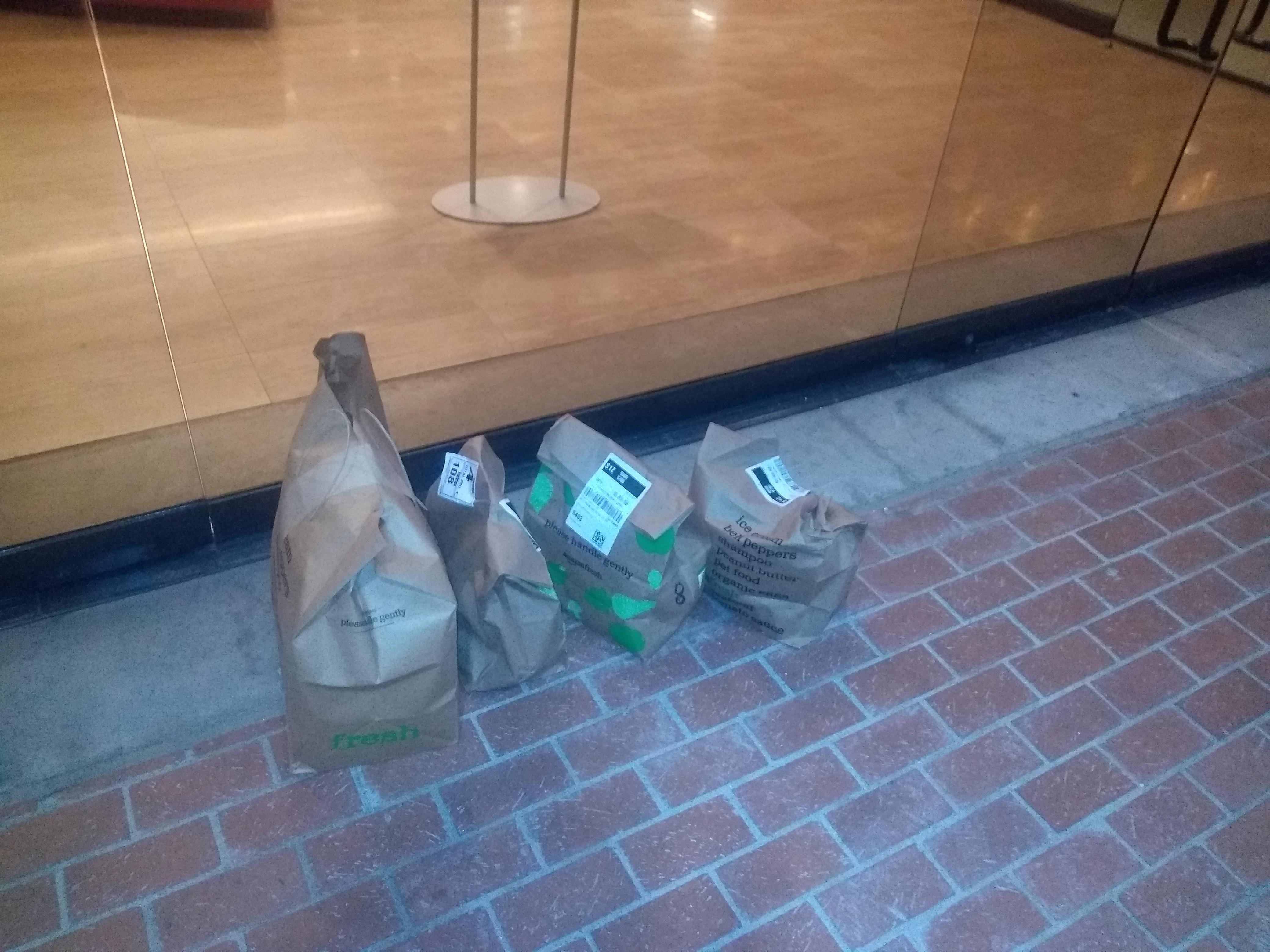 halfass Amazon food delivery. Driver just drops off groceries outside building instead of going