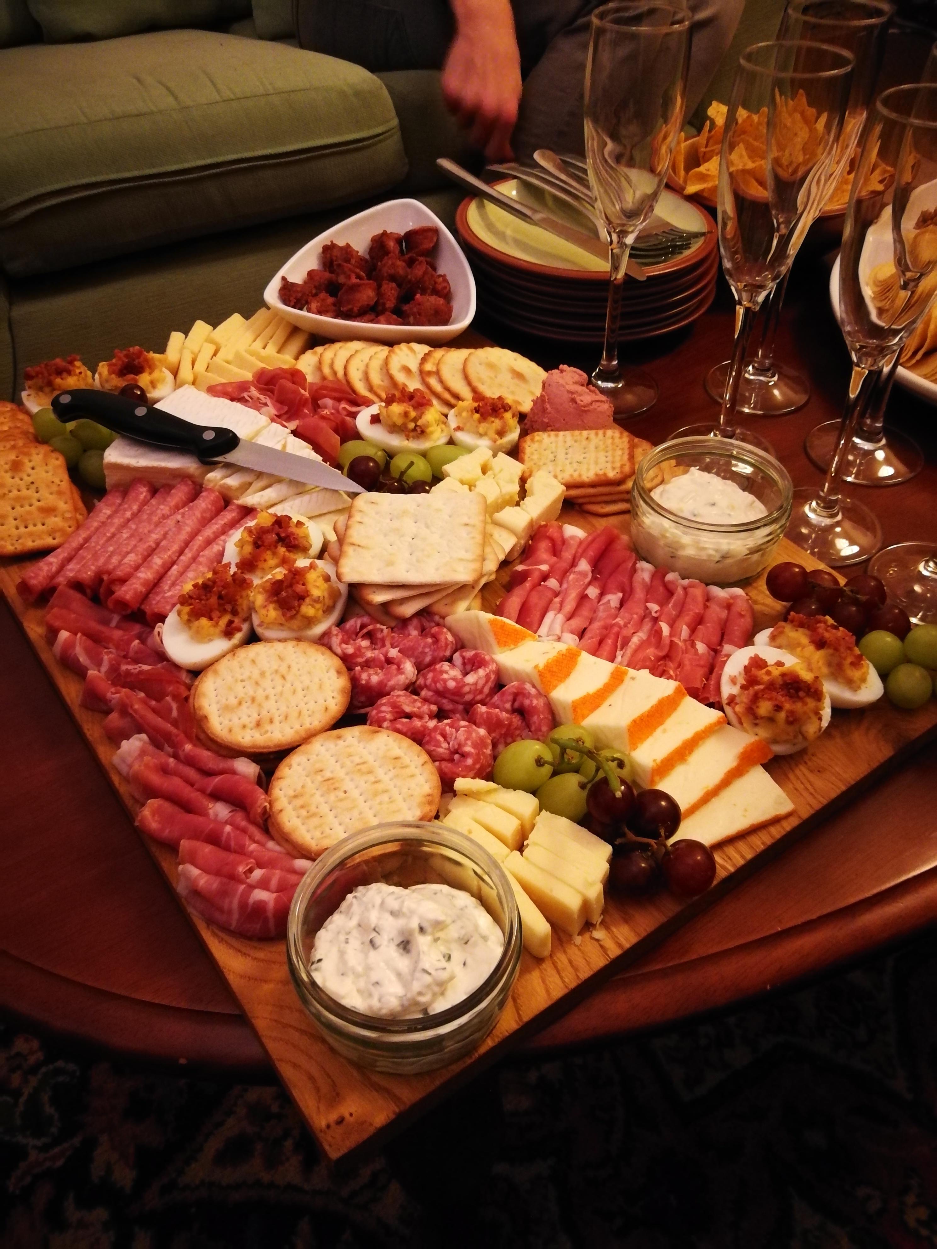 New Years Eve charcuterie. With prosciutto, salami, elk sausage, brie, port salut, smoked