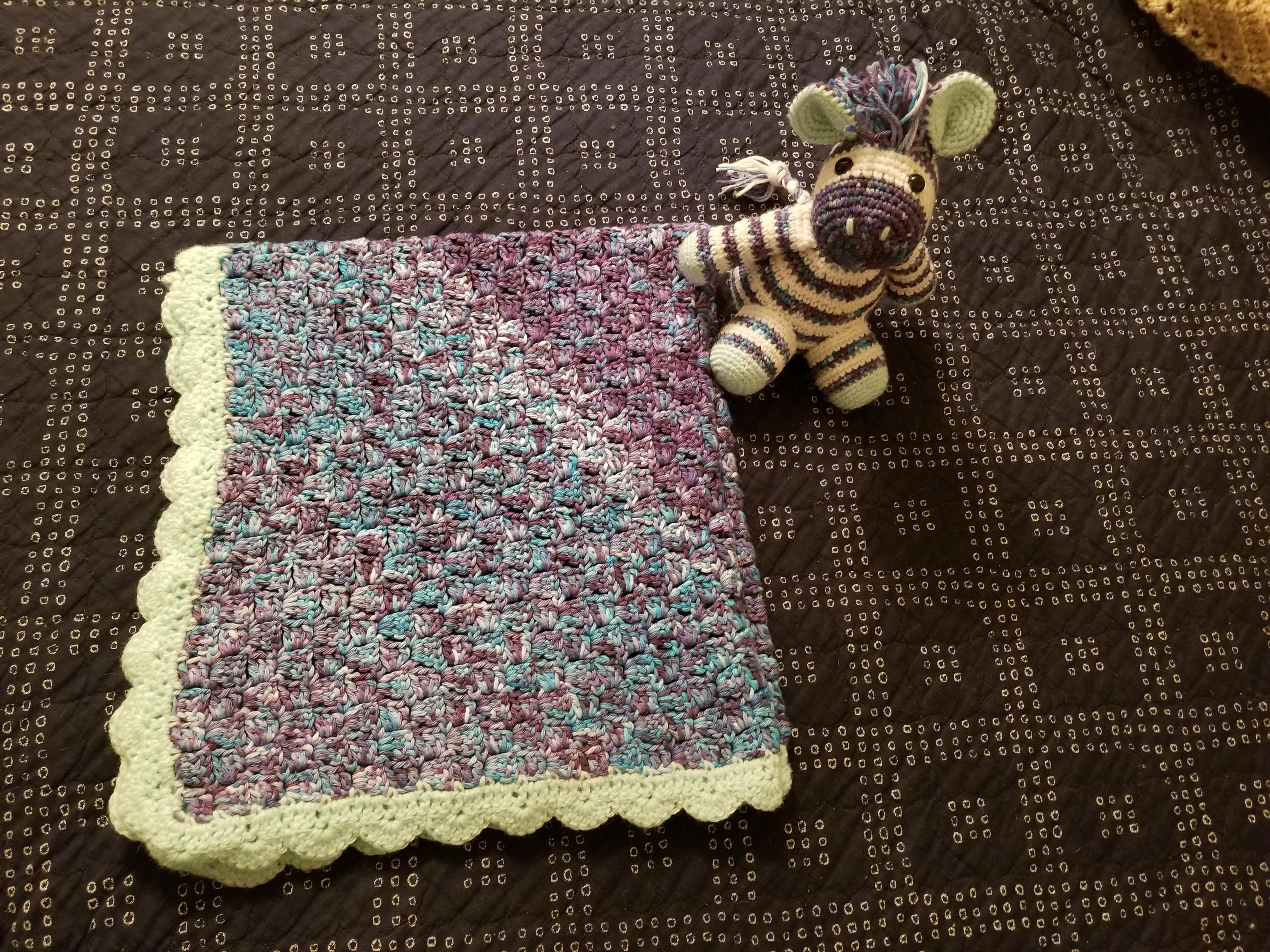 Baby blanket and stuffed animal I made for my husband's friend. I hand