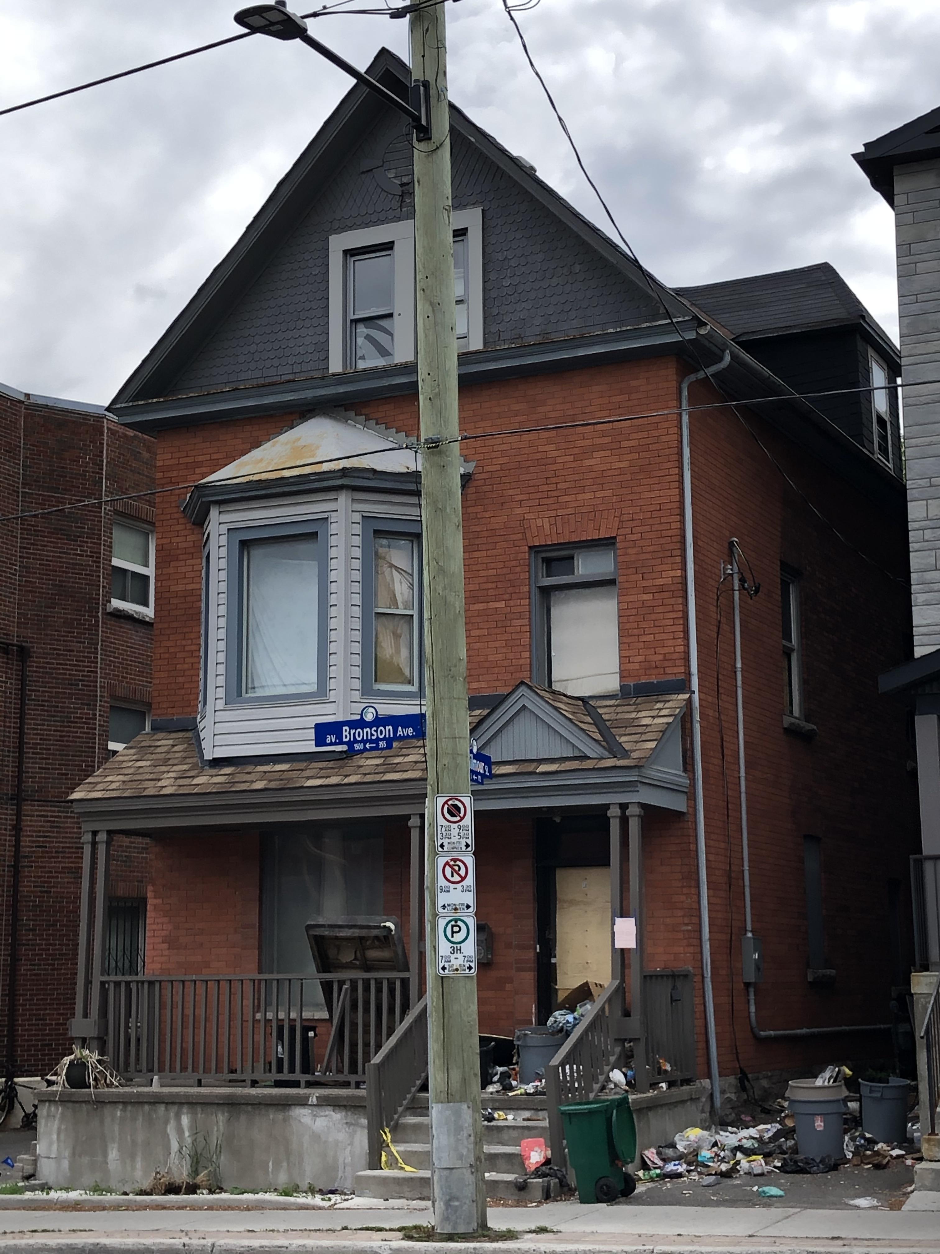 This house on Bronson (at Gilmour) is boarded off and has a growing