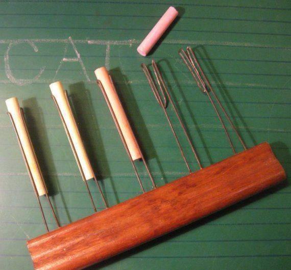 The chalk holder that the teacher used to draw lines on the board r