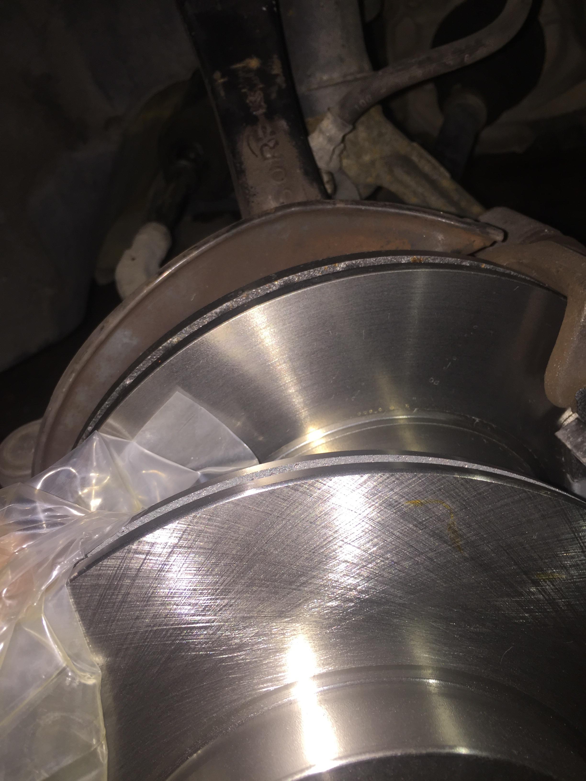 Did autozone sell me a used rotor? (Rotor in question(back) compared to