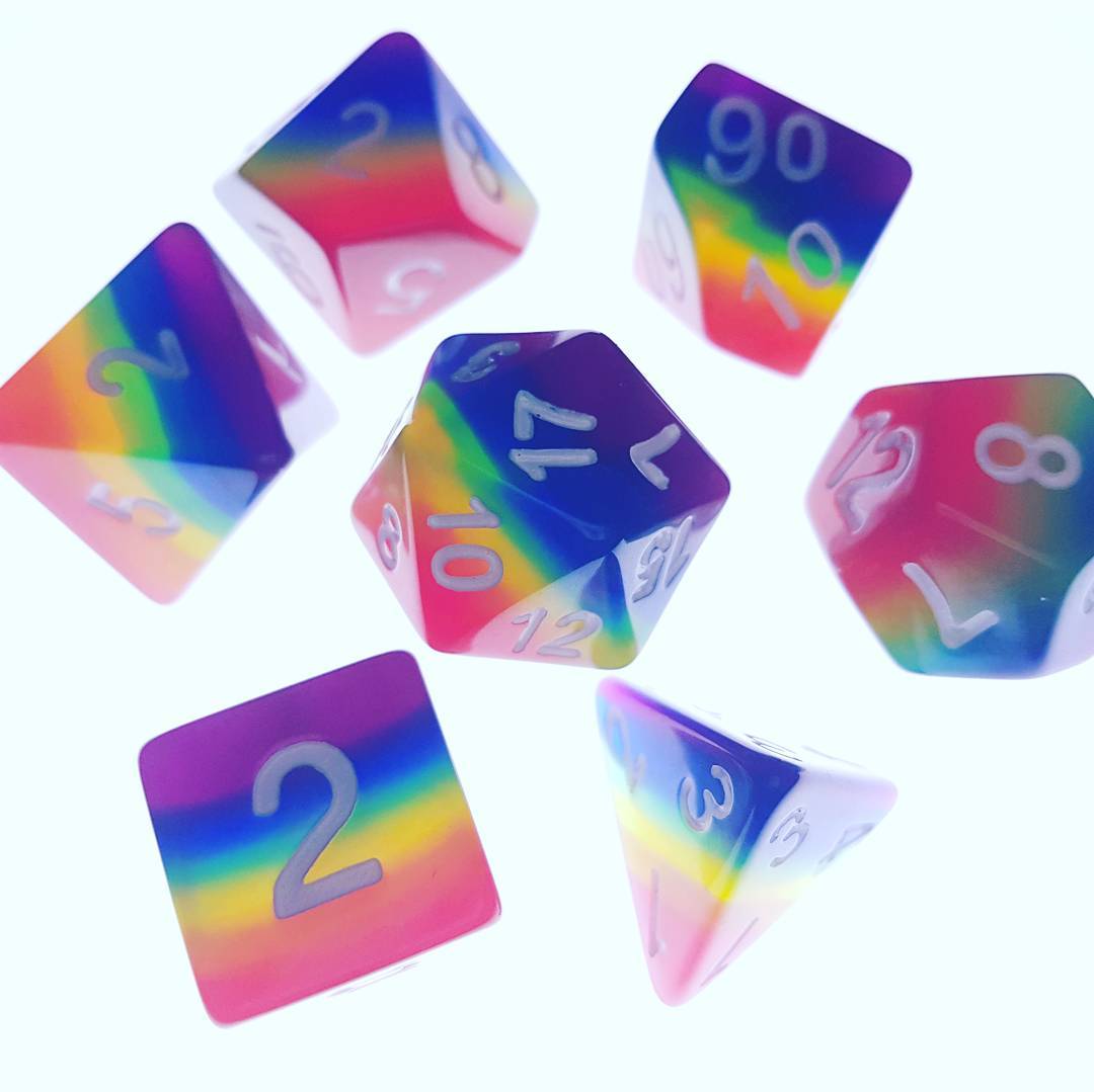 Rainbow dice set on backlight surface. r/DicePorn