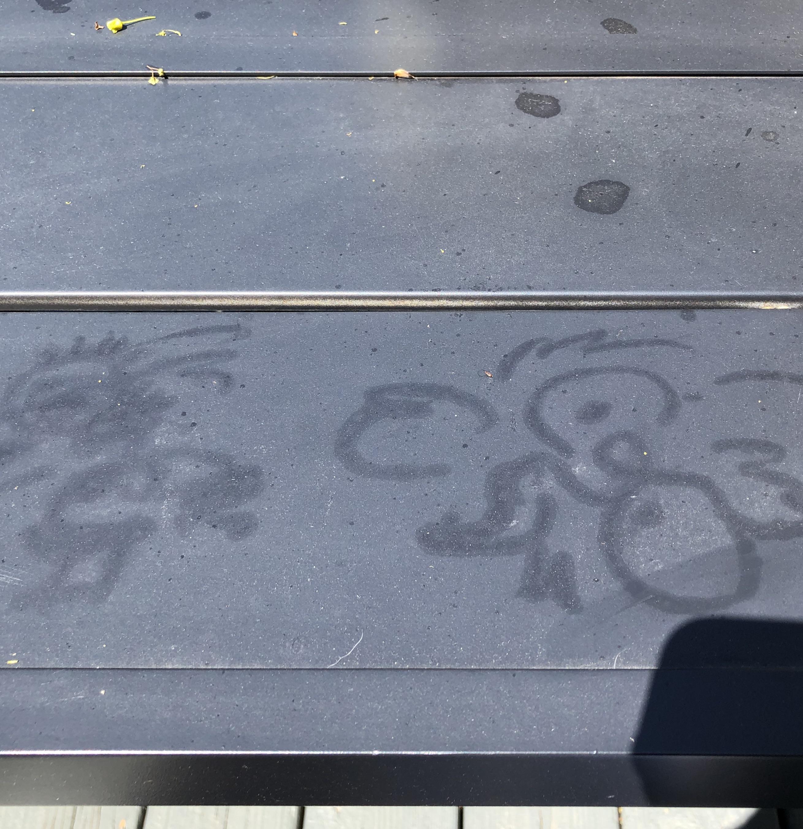 Someone drew this on my patio table with wax from a citronella candle