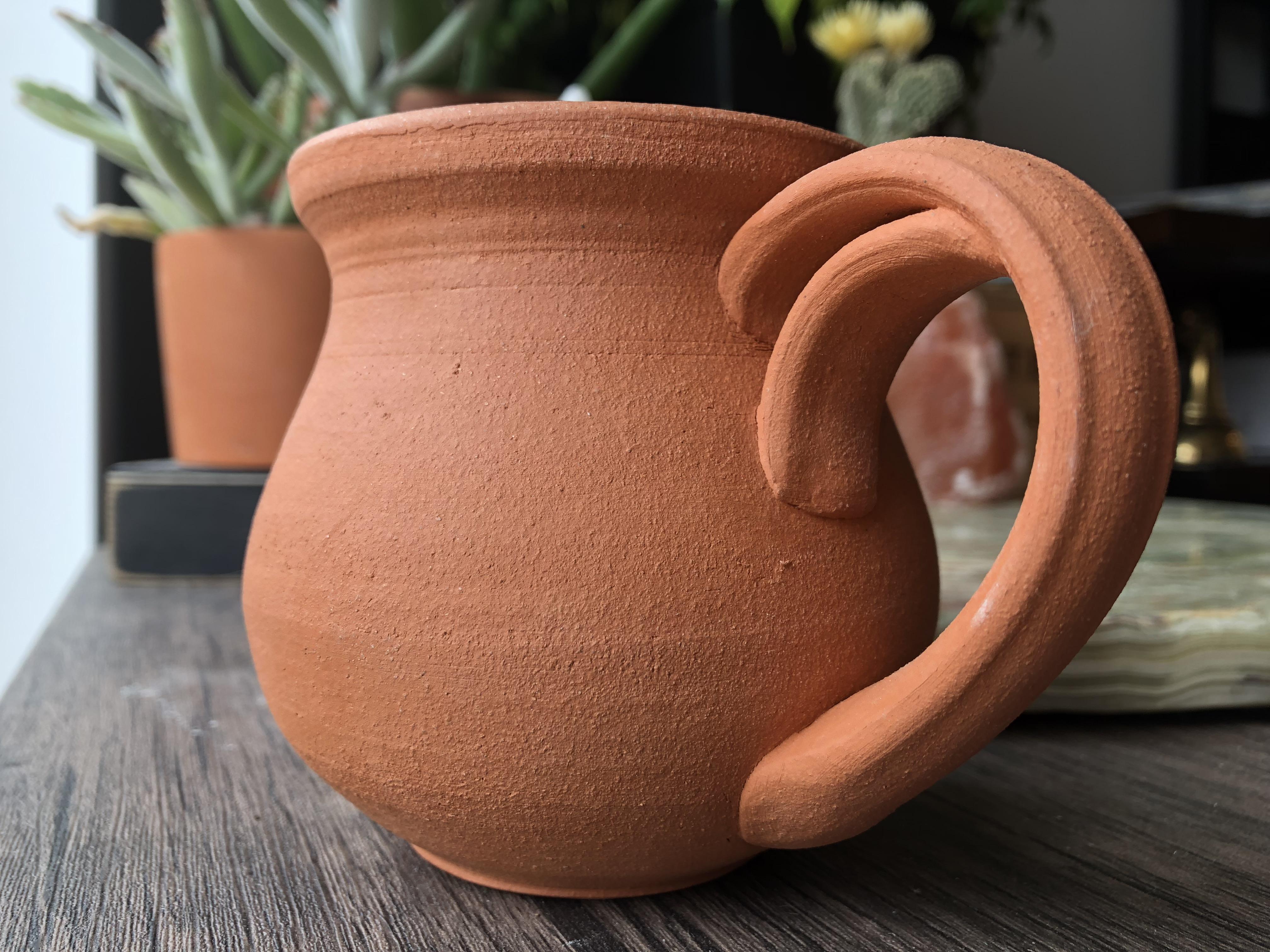 Handle shot. Pulled. Bisque Ware. Obvi hehe. r/Ceramics