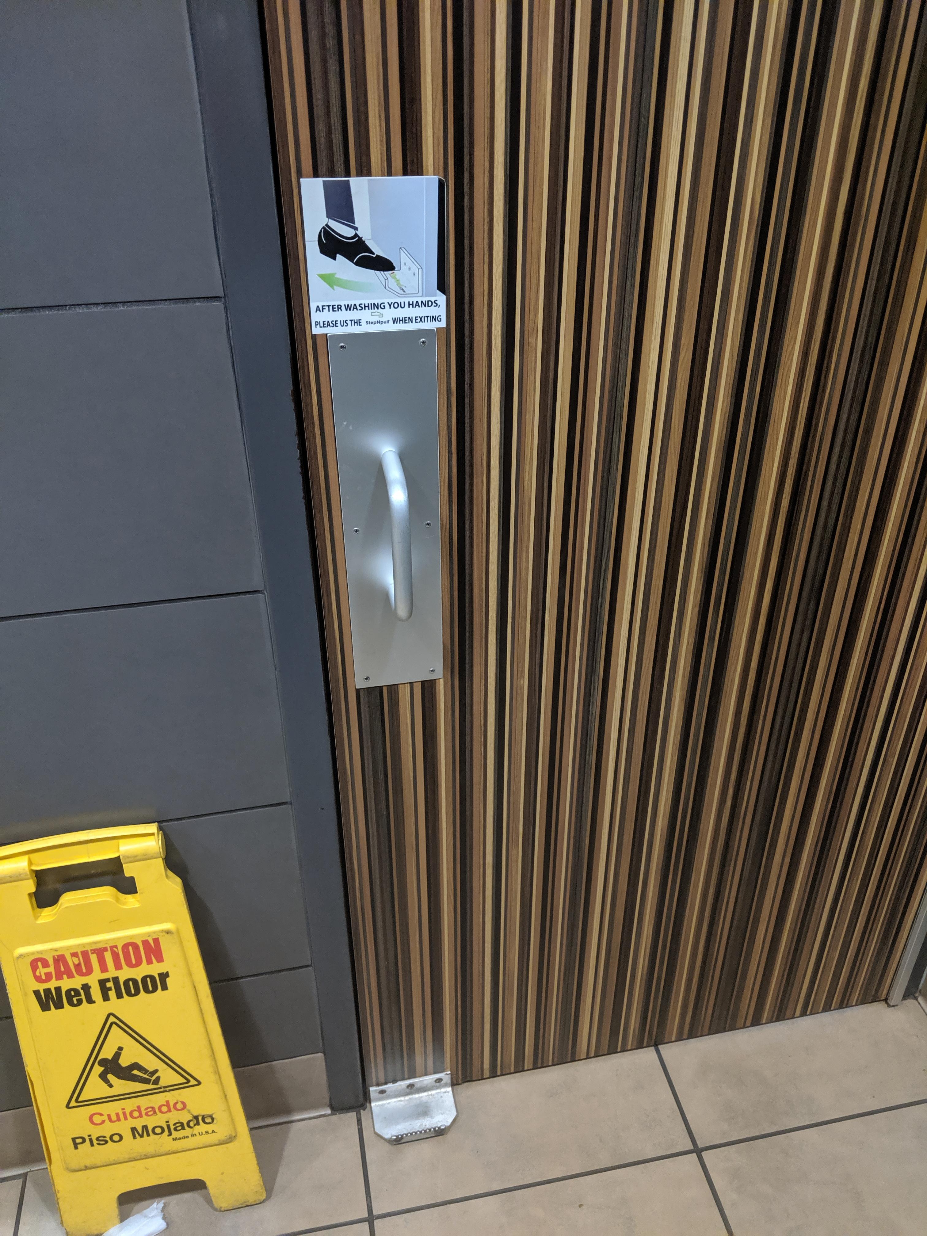 This McDonald's bathroom has a handle for your foot so you don't have