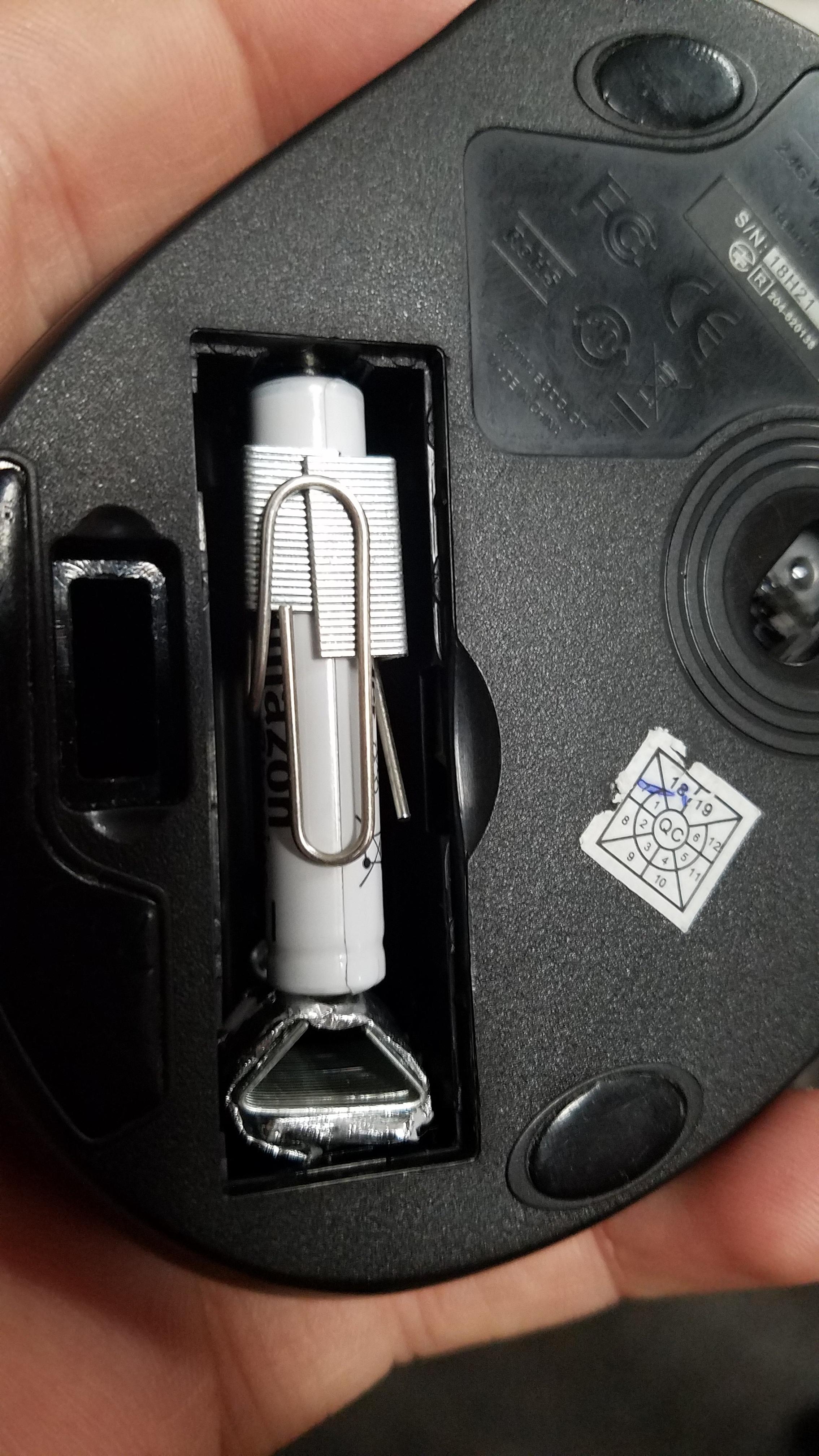 AAAA battery to AA battery adapter made with a paperclip, three strips