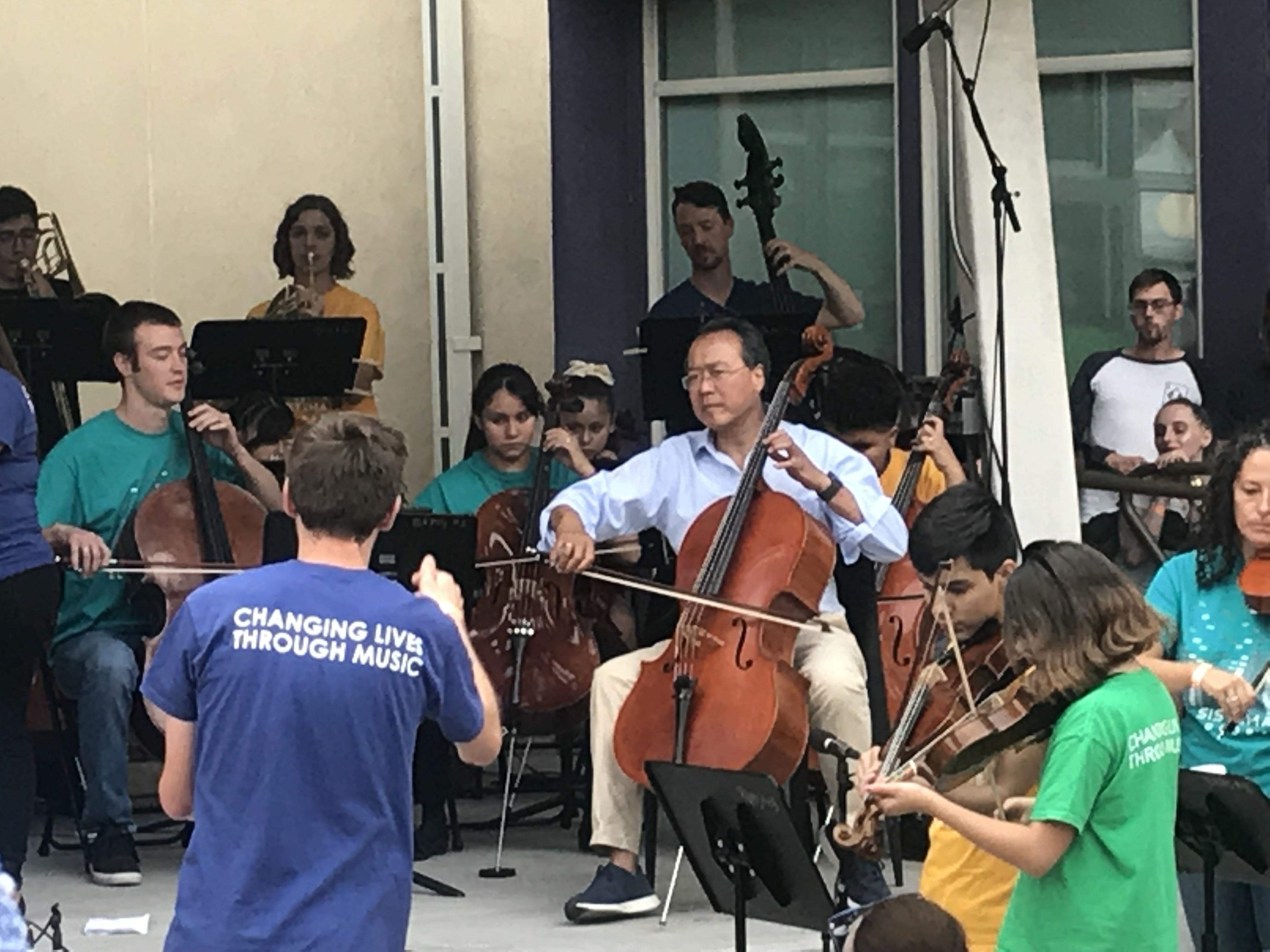 Yo Yo Ma playing with youth orchestra at Youth on Record event this