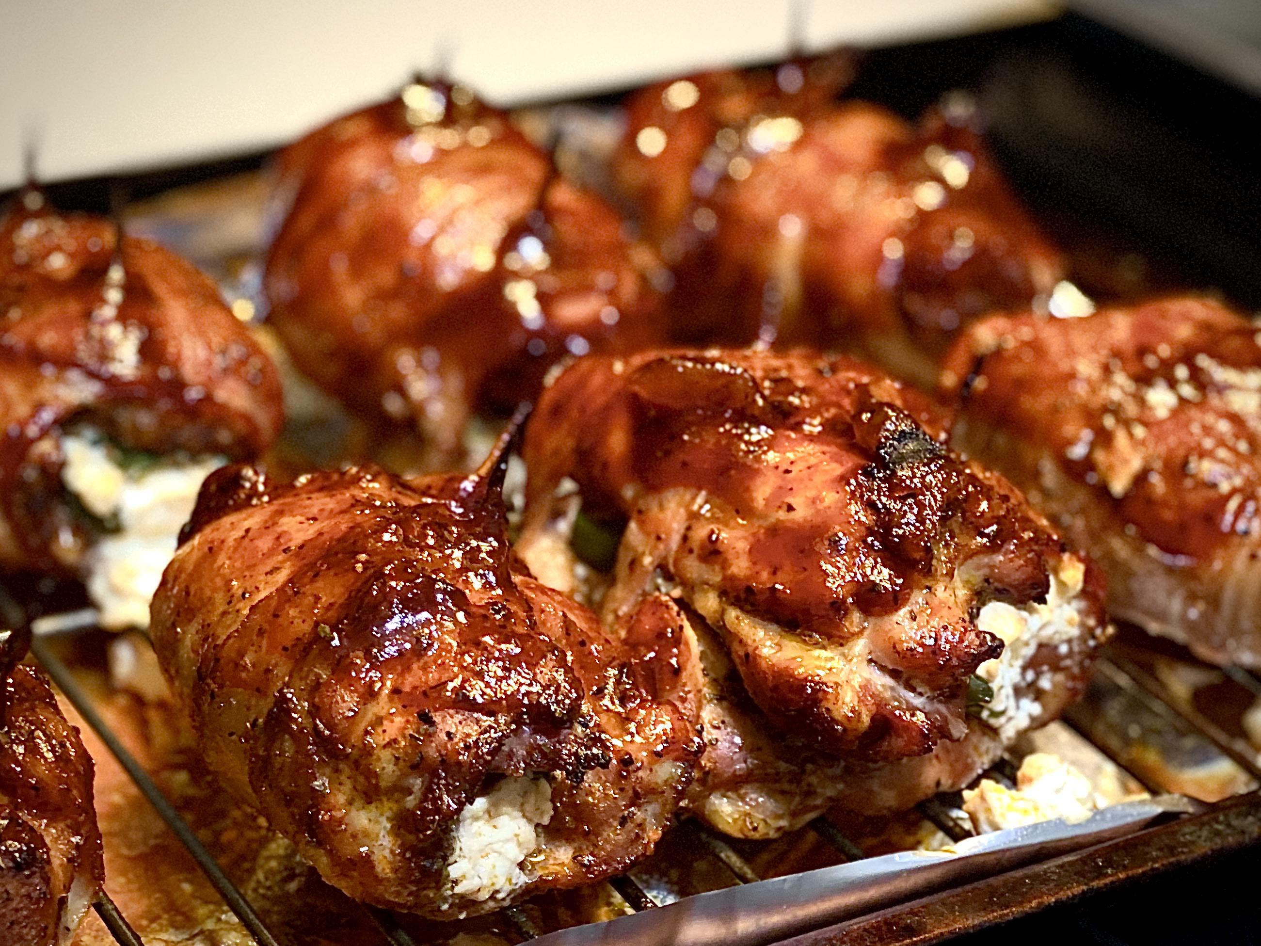 Bacon wrapped chicken thigh jalapeño poppers smoked on the Yoder r