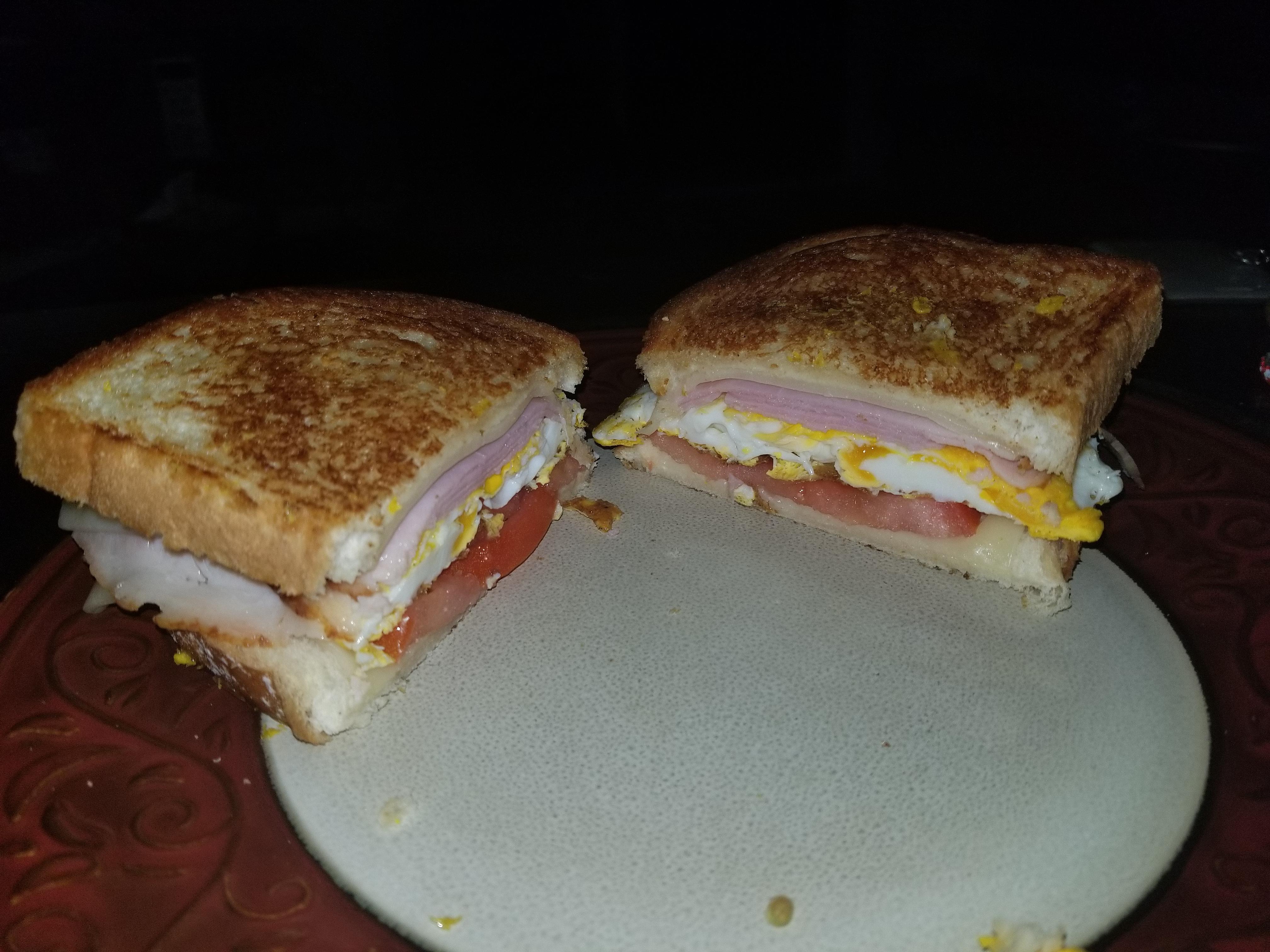 [MELT] sourdough ham egg tomato swiss and a lot of butter r/grilledcheese