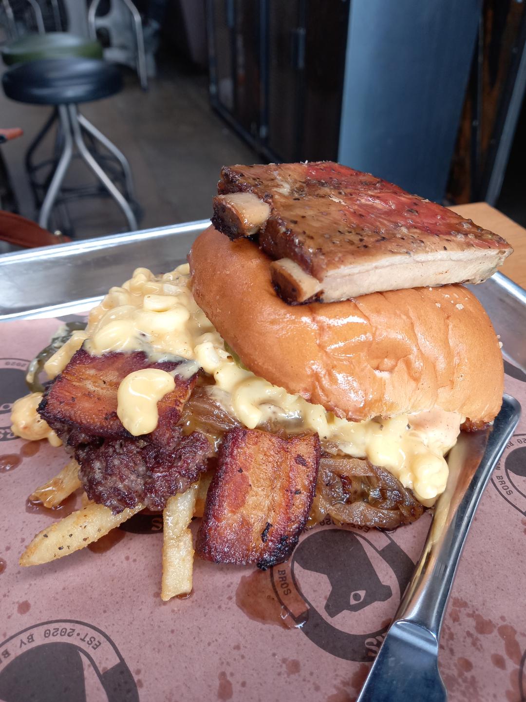 [I Ate] A Mac n cheese smash burger with pork belly burnt ends and ribs