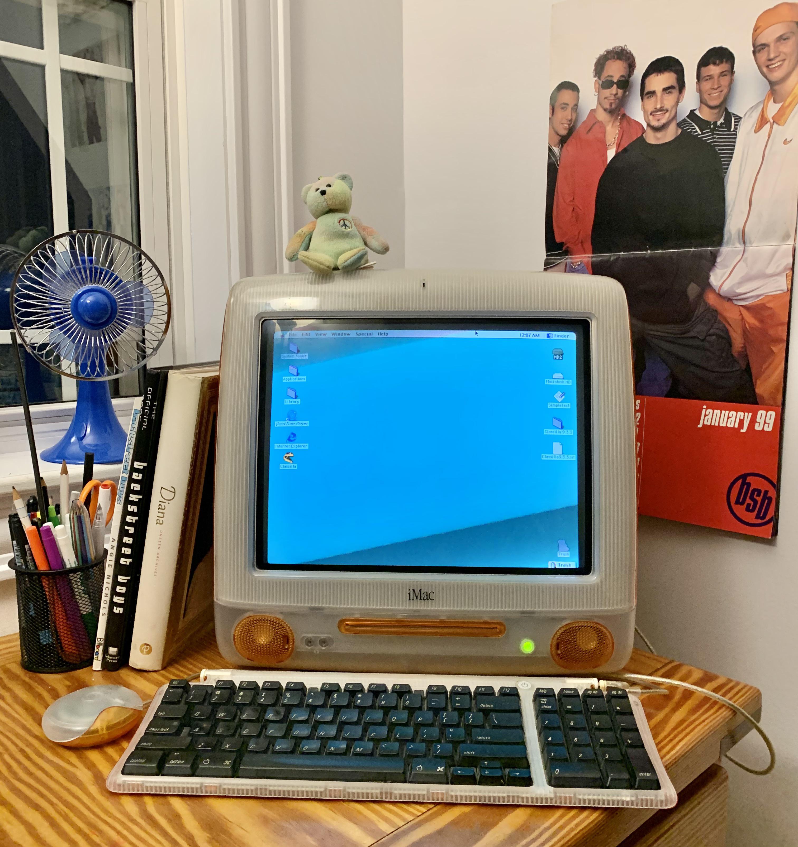 My working tangerine iMac G3 in its natural habitat. Complete with original mouse and keyboard