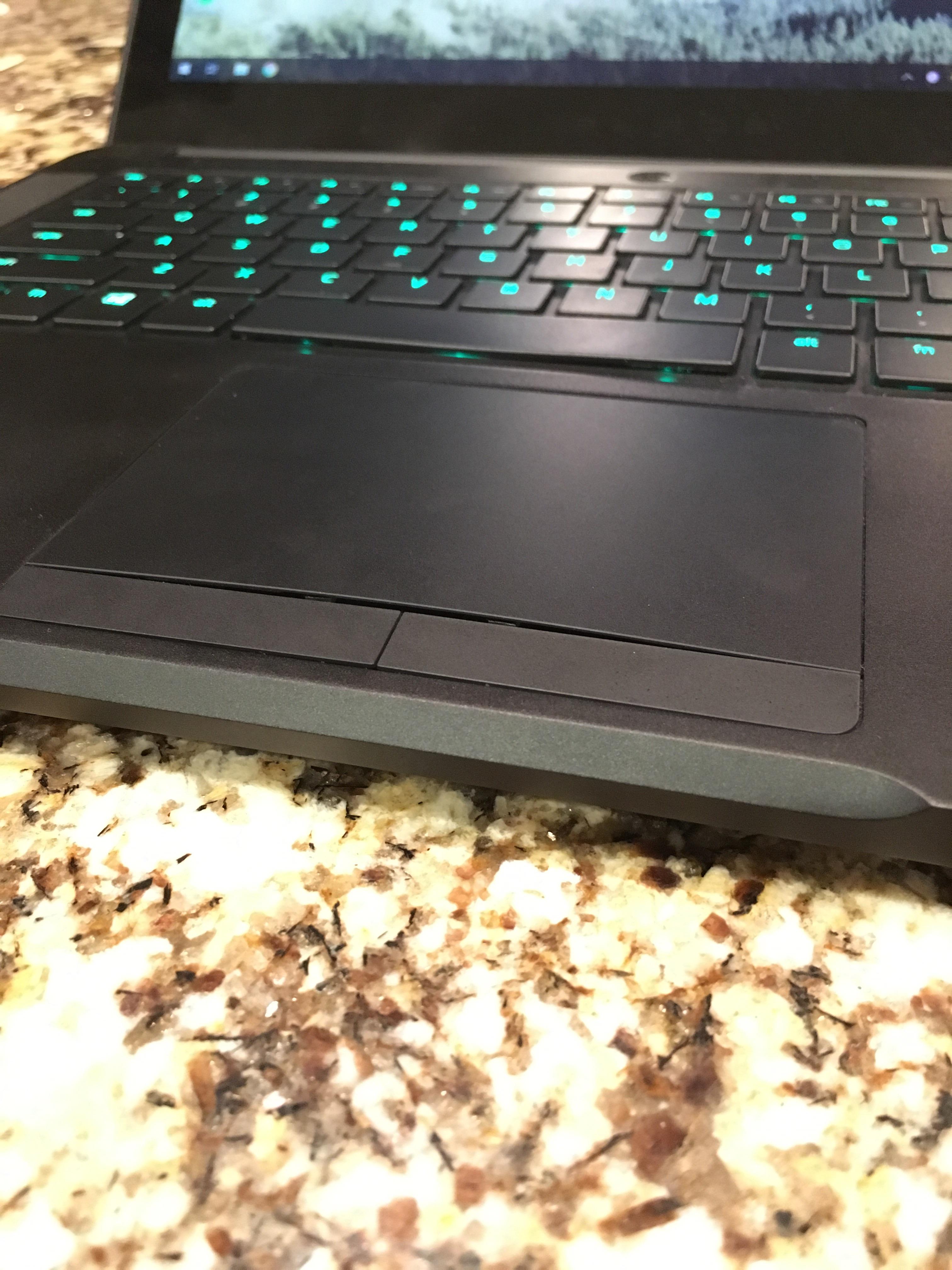 Razer Blade touchpad starting to bow. What could cause