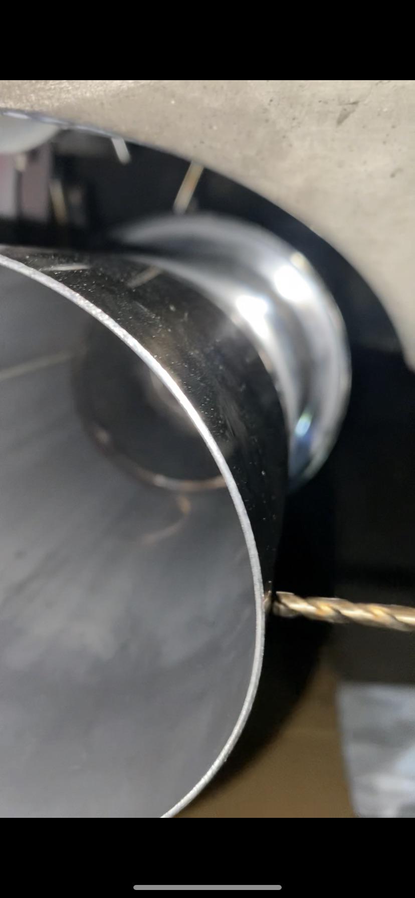 Can’t drill a hole through steel exhaust tip no matter what I try : r