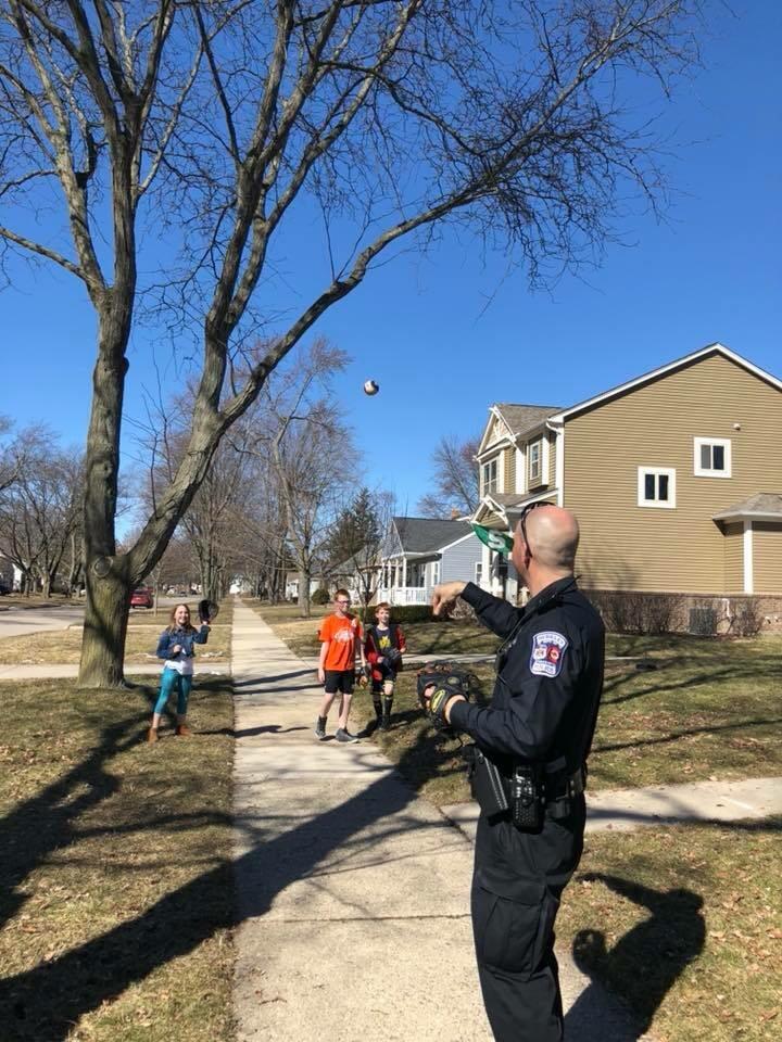 Police officer in Berkley, MI takes a break for a game of catch r/pics