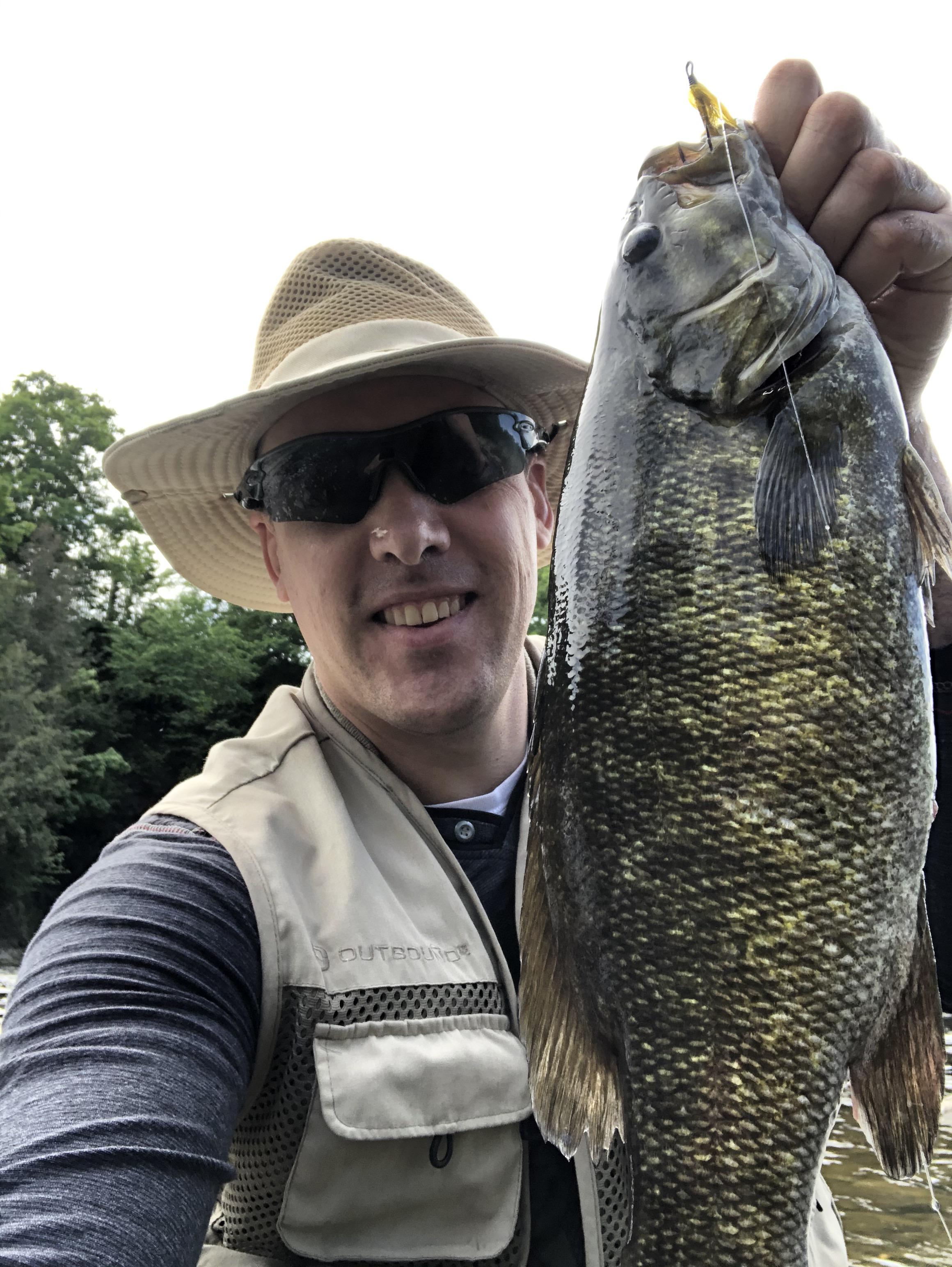Smallmouth bass, using fly rod. r/Fishing