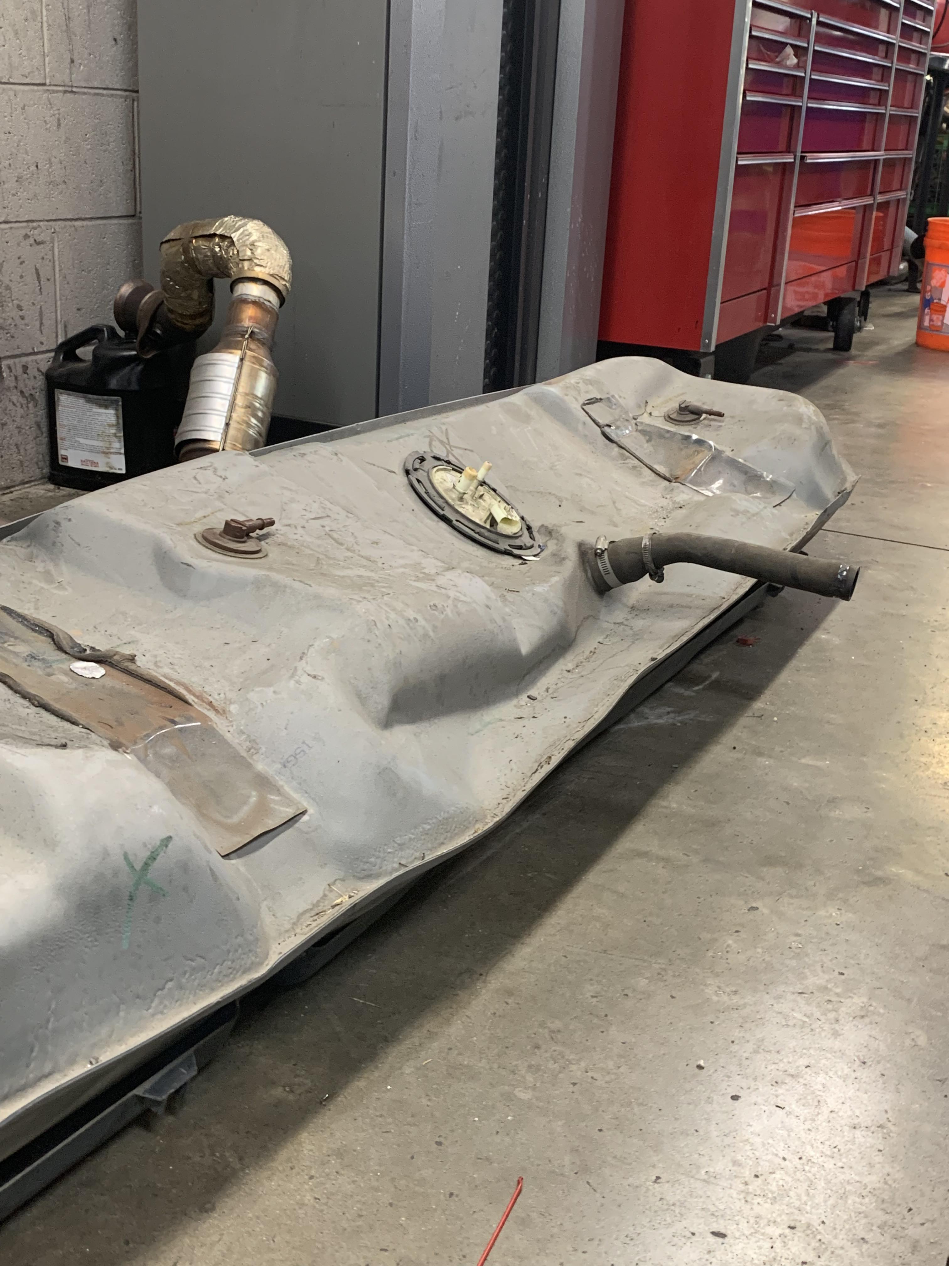 Purge valve stuck open, pulled enough vacuum to suck the fuel tank in