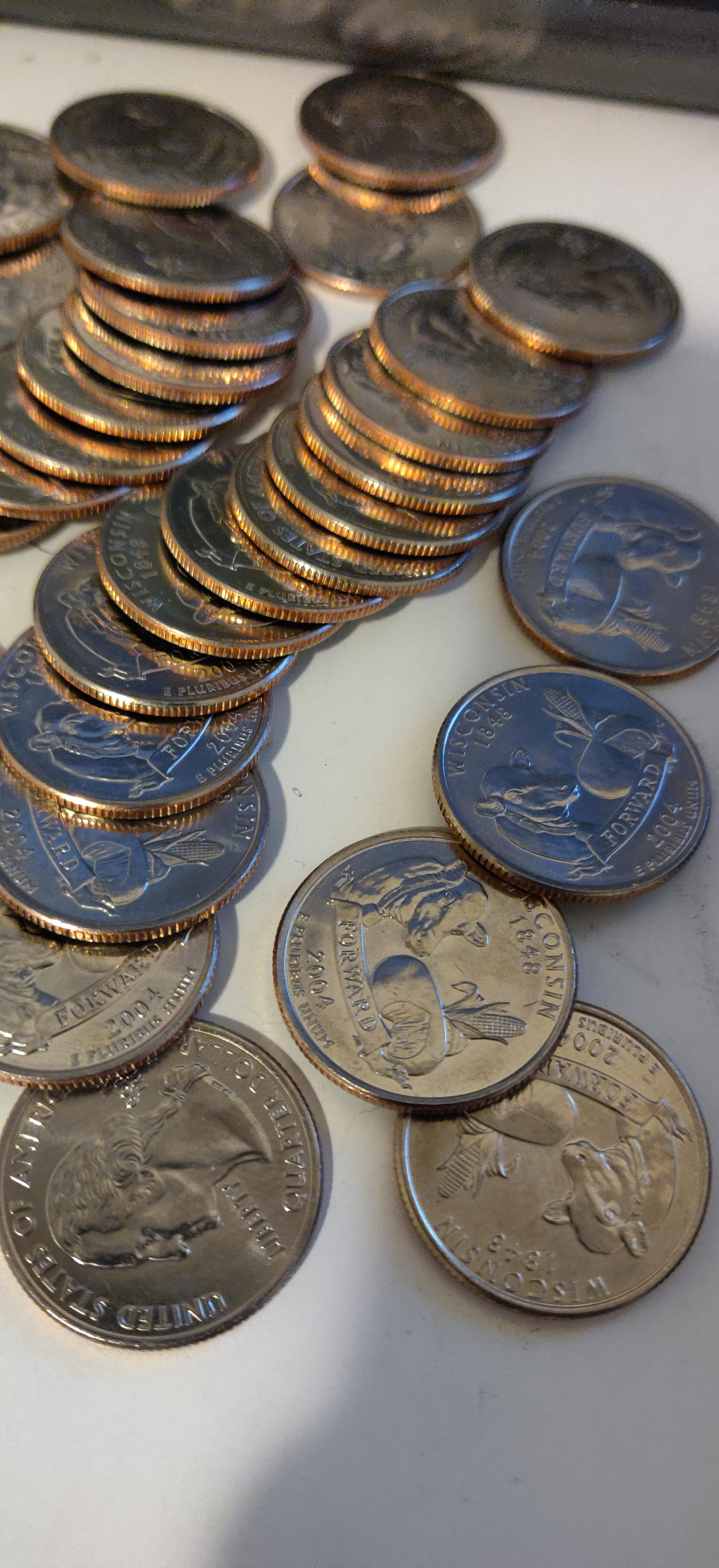 At work I opened a roll full of 2004 WI D quarters that look very new