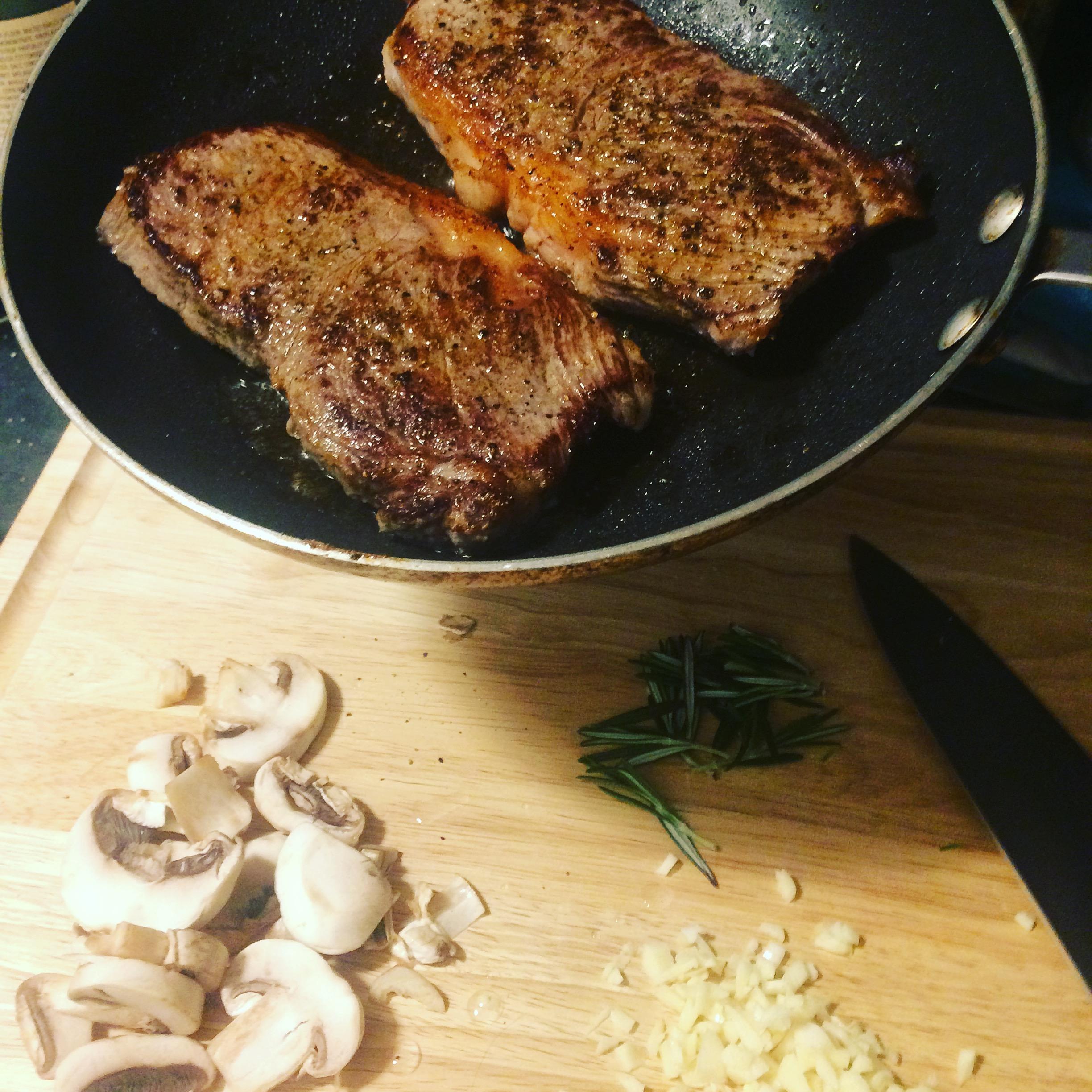 I made a simple dinner of KC strip steak with rosemary, garlic, and
