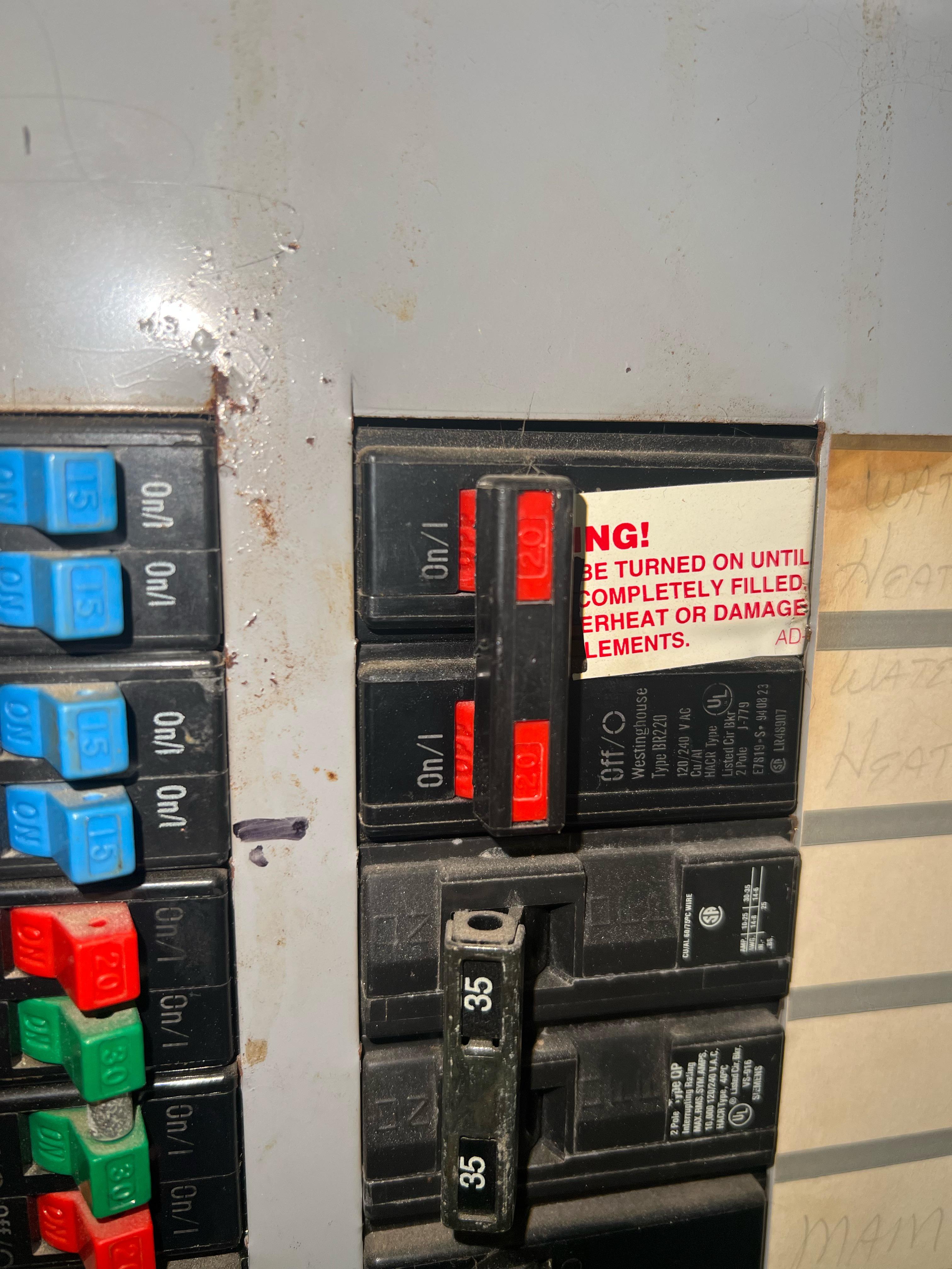 Water heater breaker stuck in middle r/askanelectrician