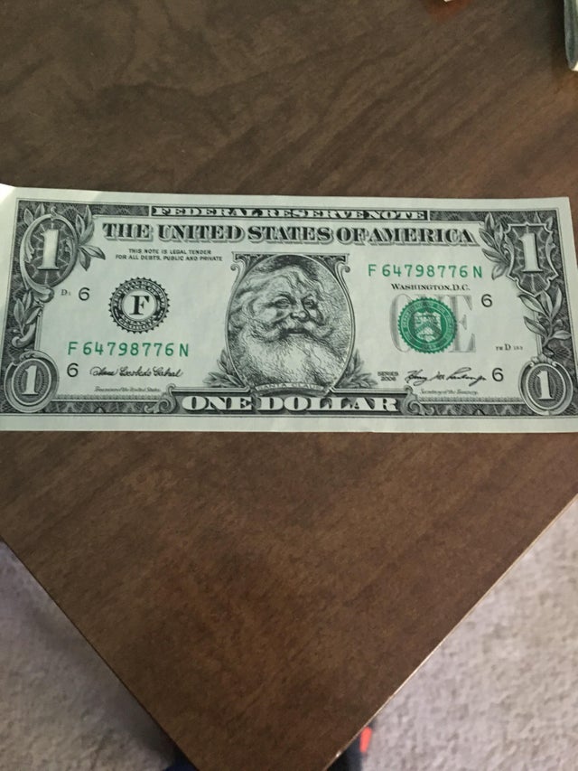 A Santa Clause dollar bill, the Santa part can peel away to reveal an