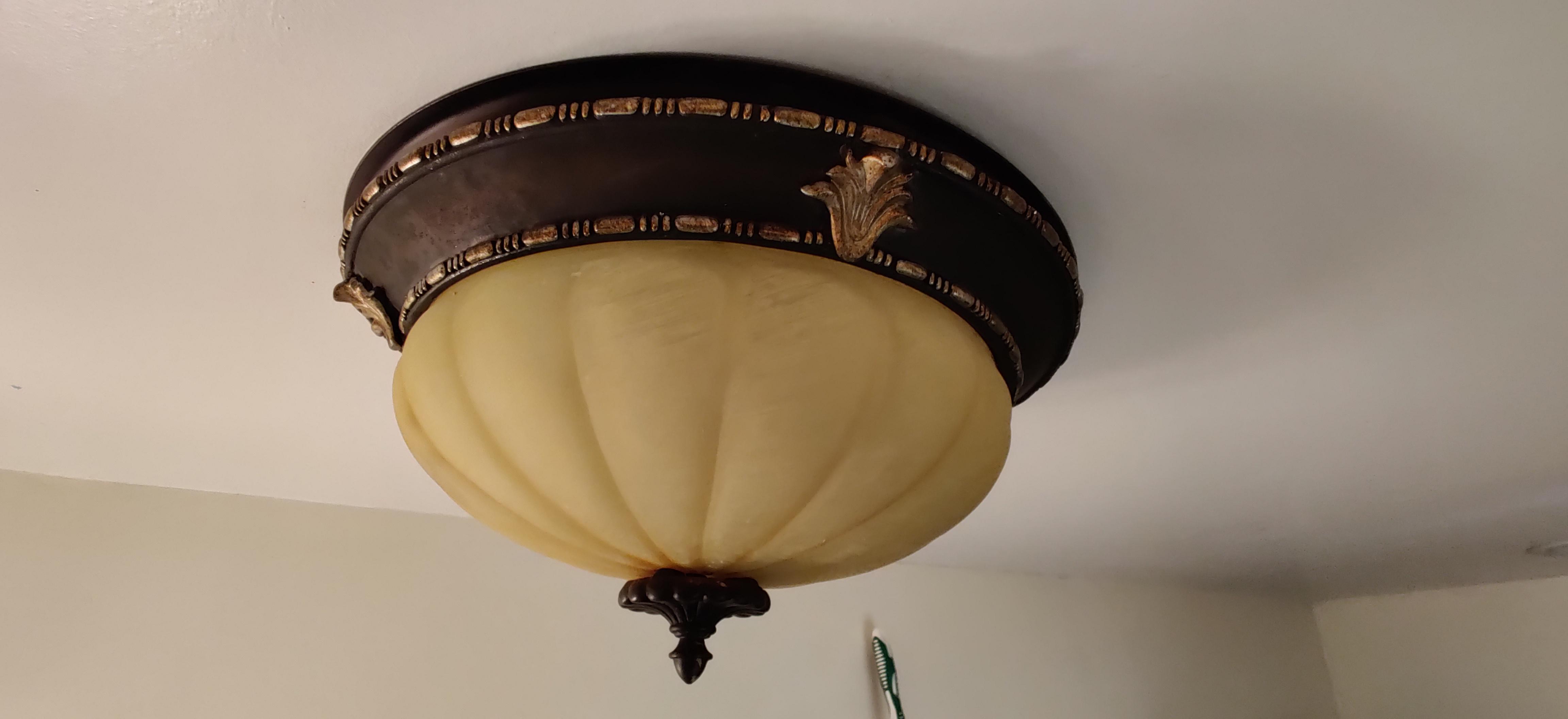 Anyone have any idea how to remove this bathroom light/fan fixture? The