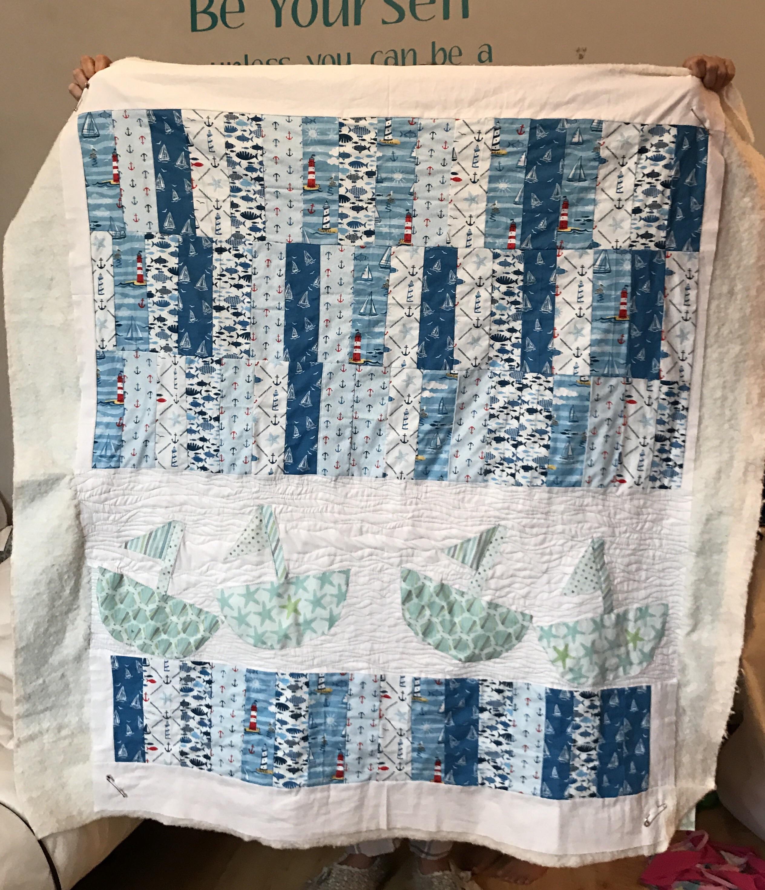 How's my little quilt looking? Just need to finish the wavy quilting then stitch the ditches