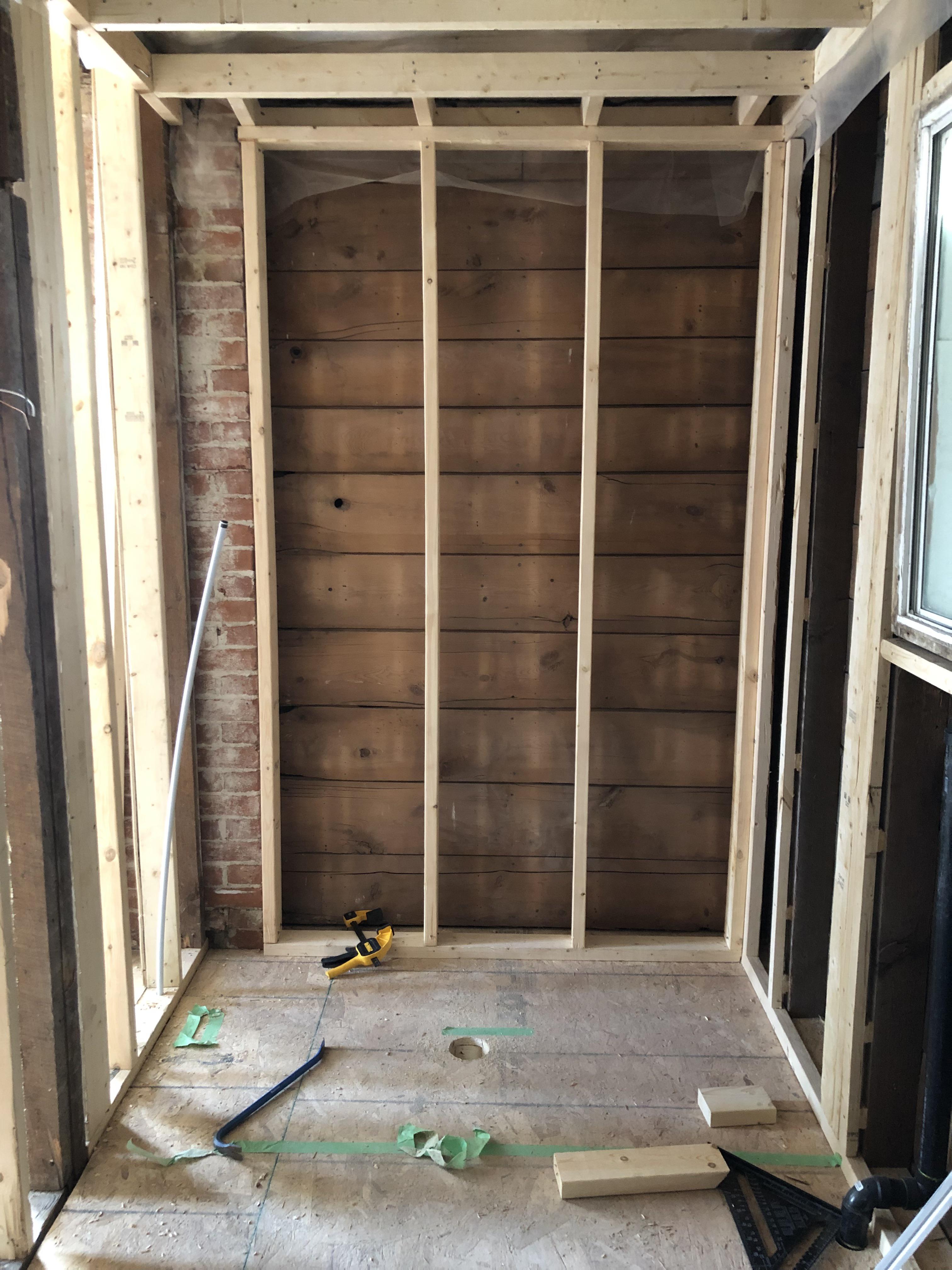 Is it possible to expose brick in shower with a glass/acrylic wall? r