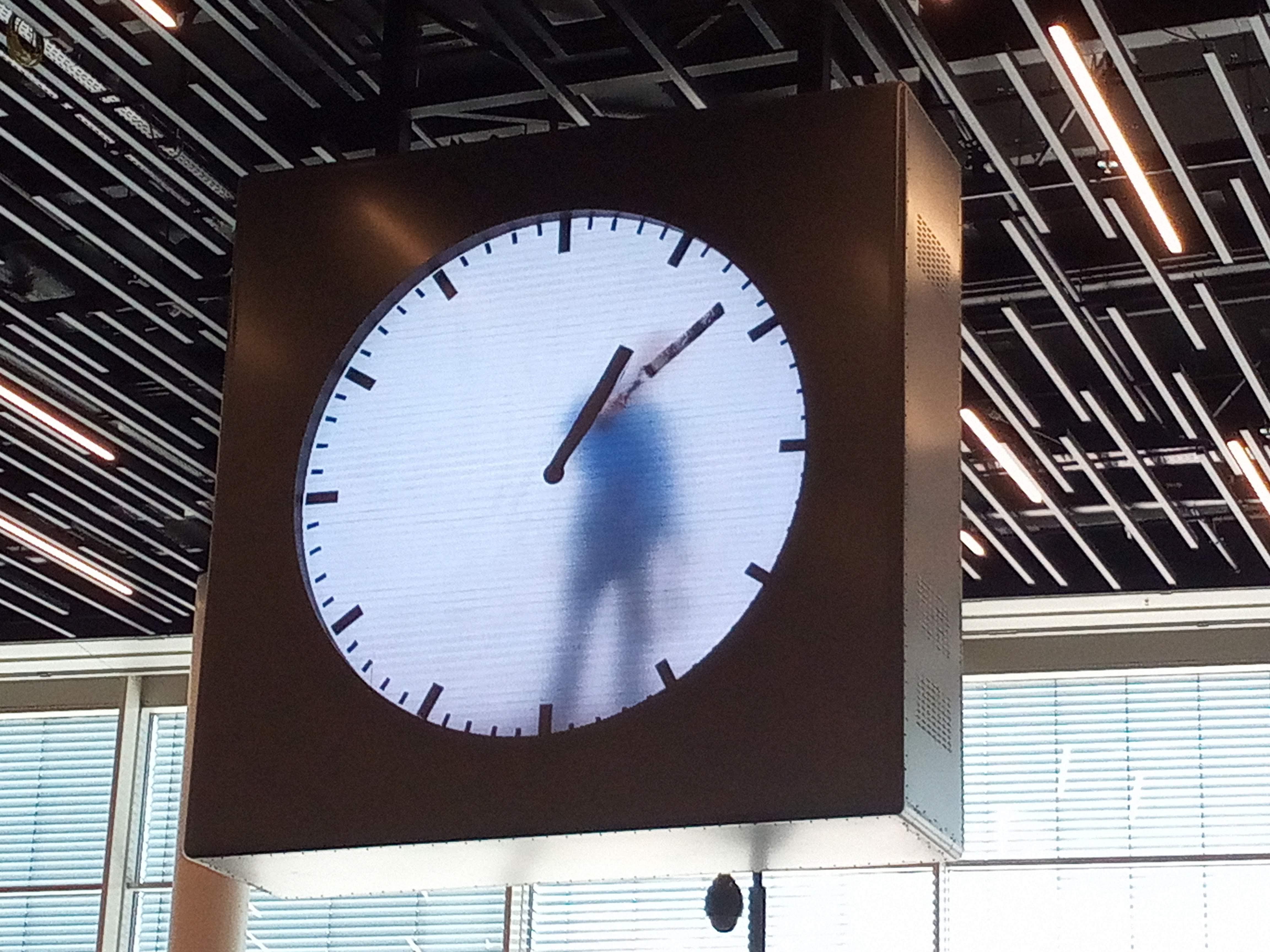 Schiphol airport in Amsterdam has a clock with an animation of a man