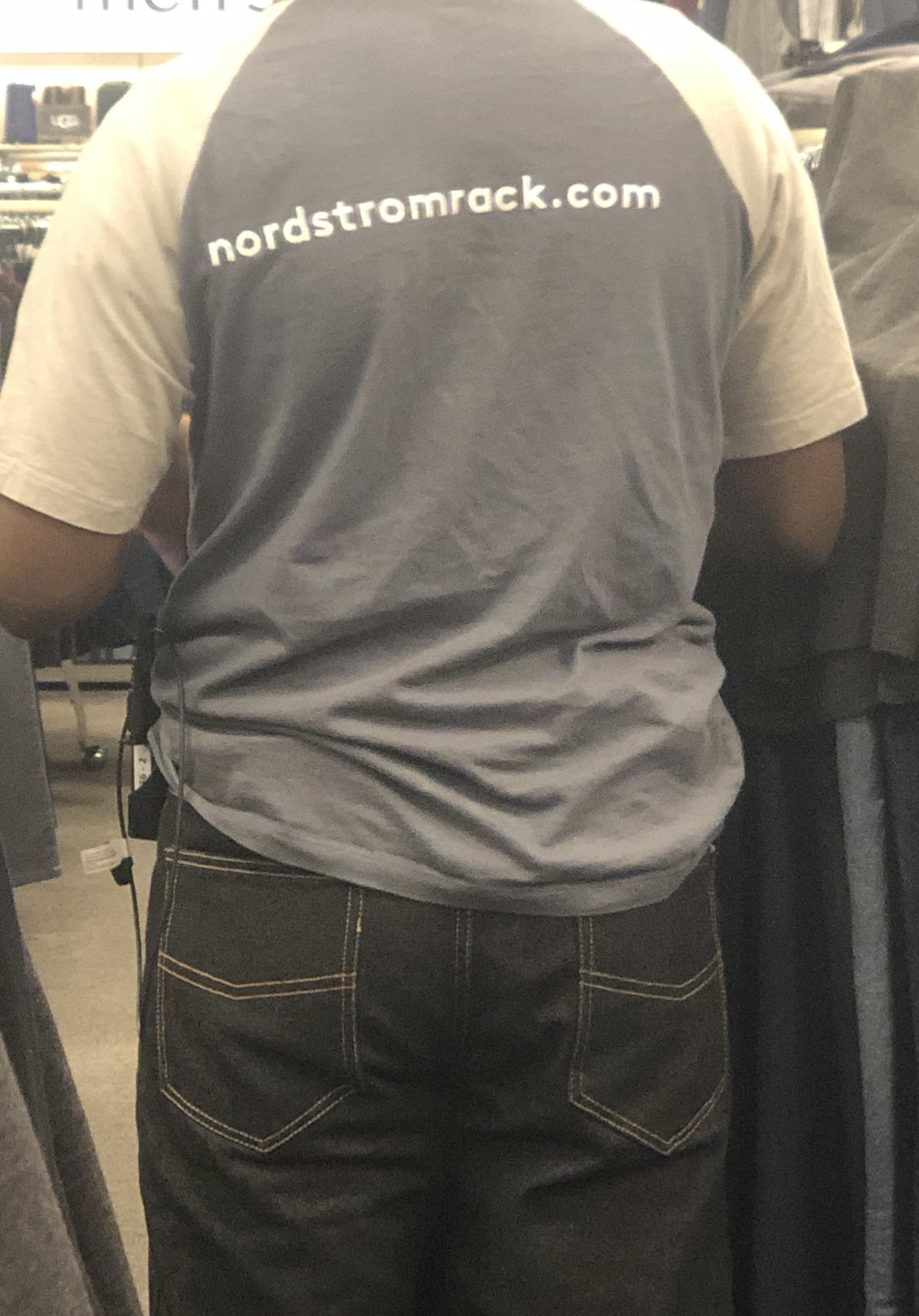 The text on Nordstrom Rack employee shirts isn’t centered on the shirt