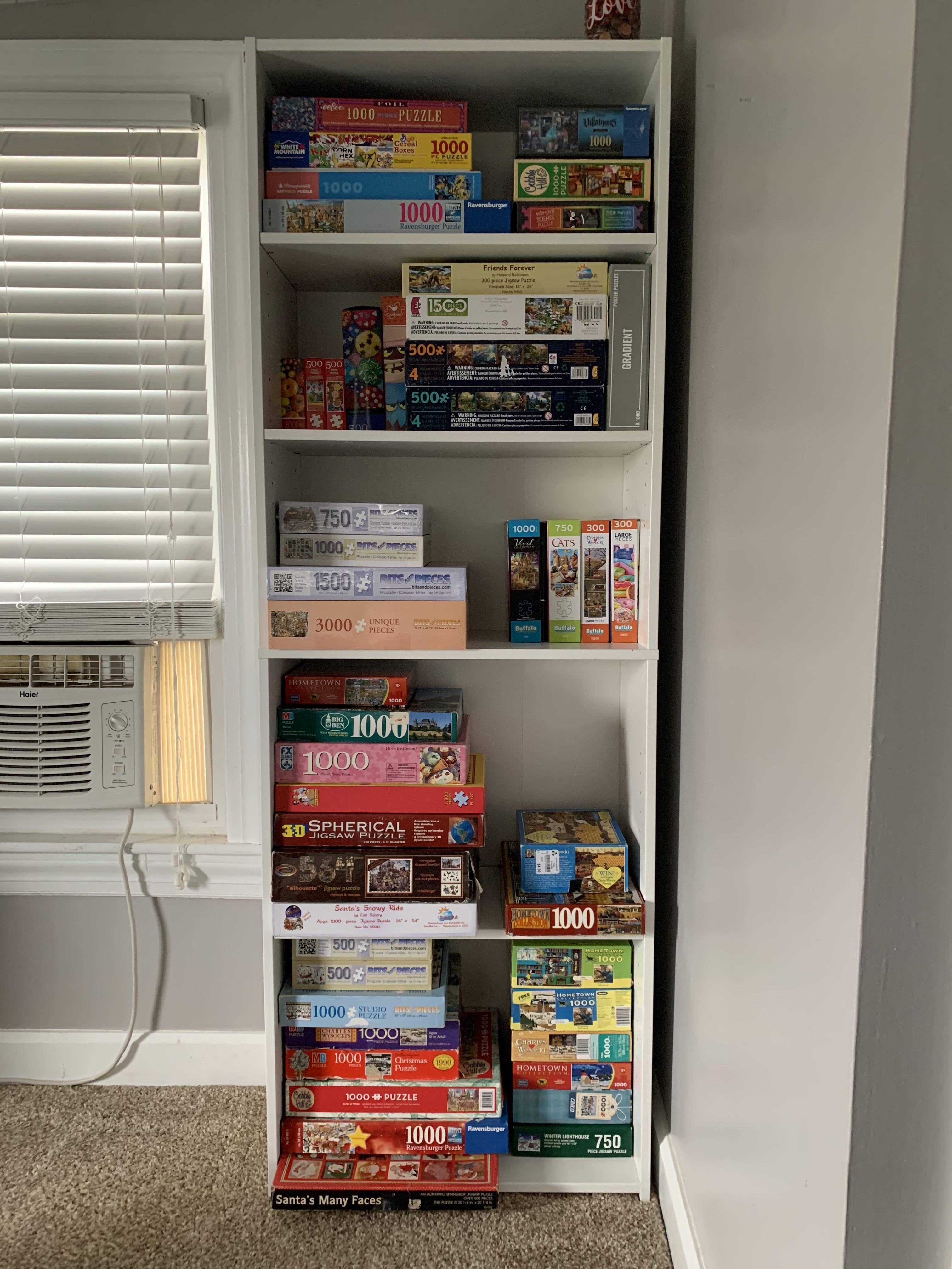 Finally got myself a bookshelf for all of my jigsaw puzzles. 35 dollars
