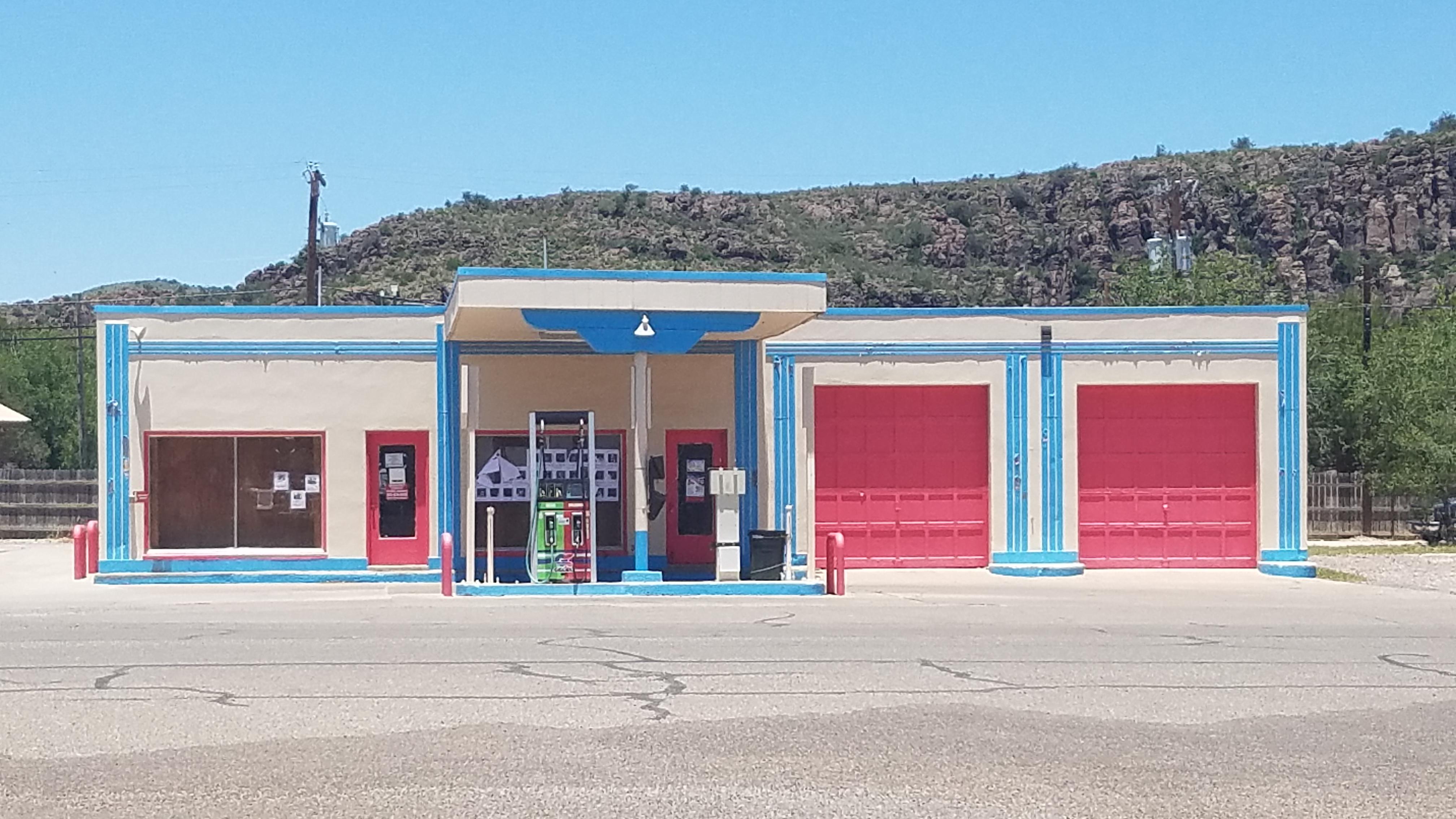 Colorfully painted gas station in West Texas. r/AccidentalWesAnderson