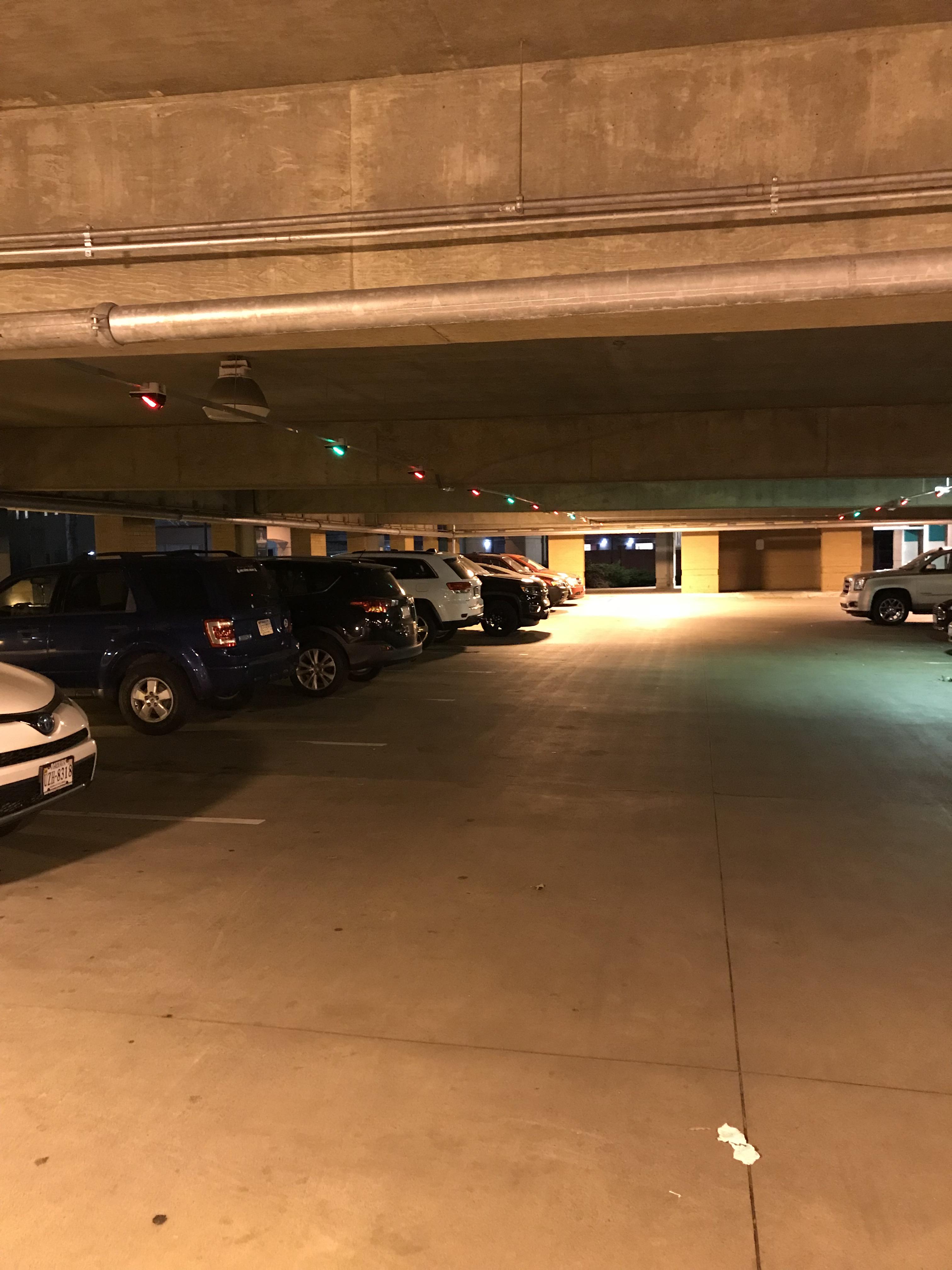 This parking garage has lights over every spot so you can see if it has