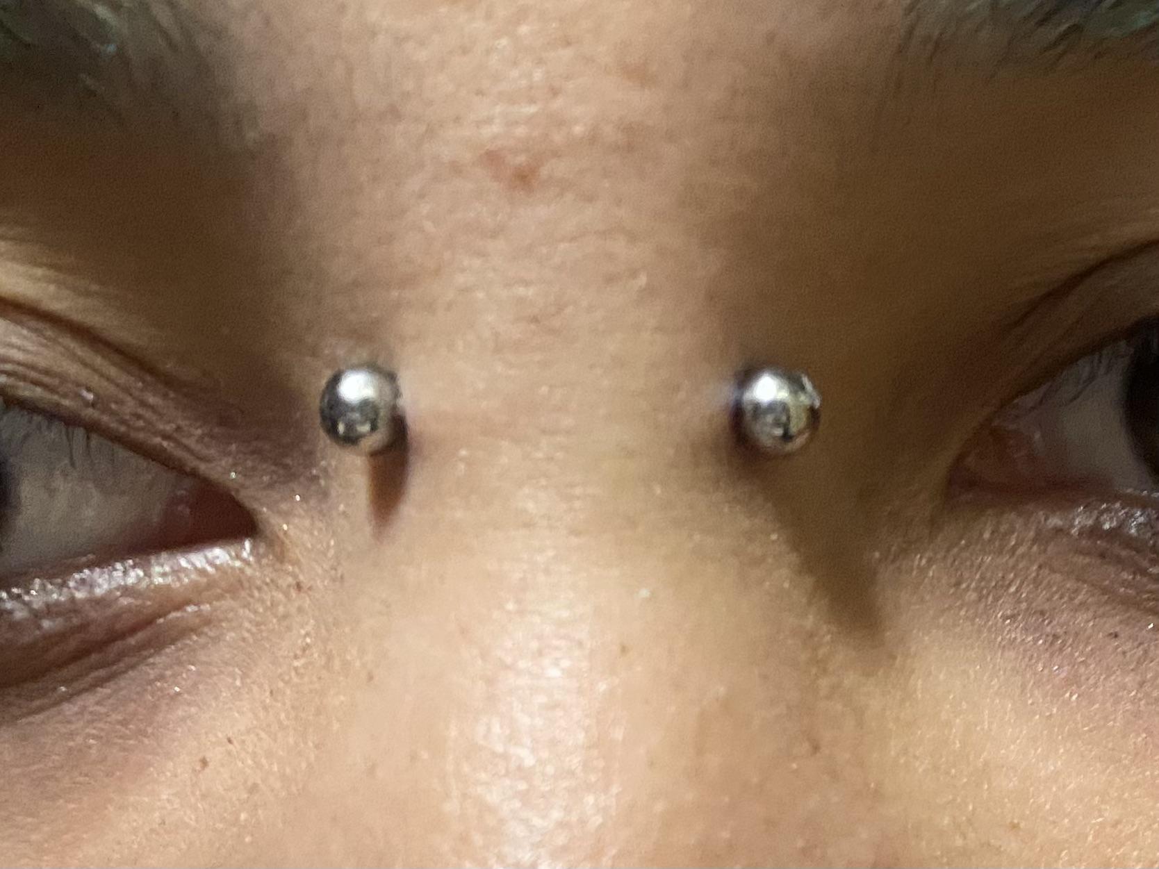 HELP! Is my bridge piercing rejecting? I got it pierced 2 days ago so i